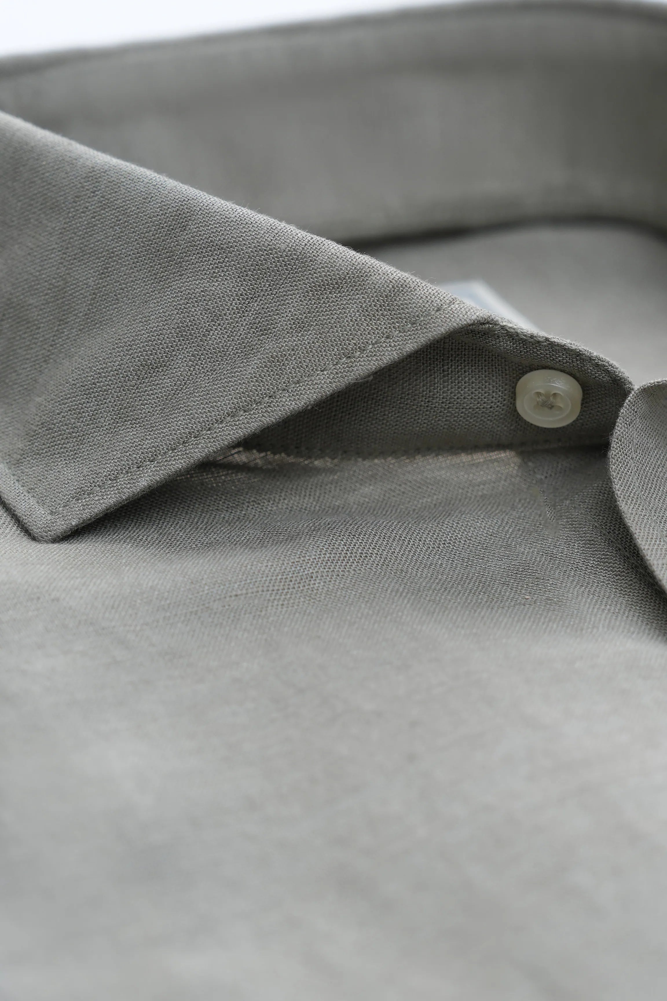 Light gray linen shirt collar with wide spread collar and button