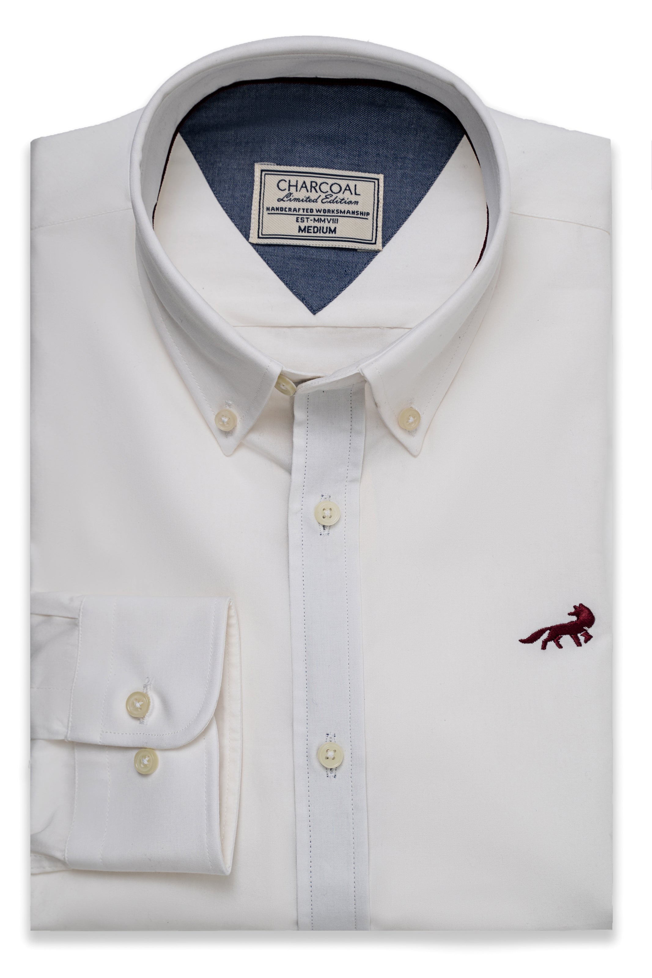 White button-up shirt with collar, gold buttons, and red dinosaur logo