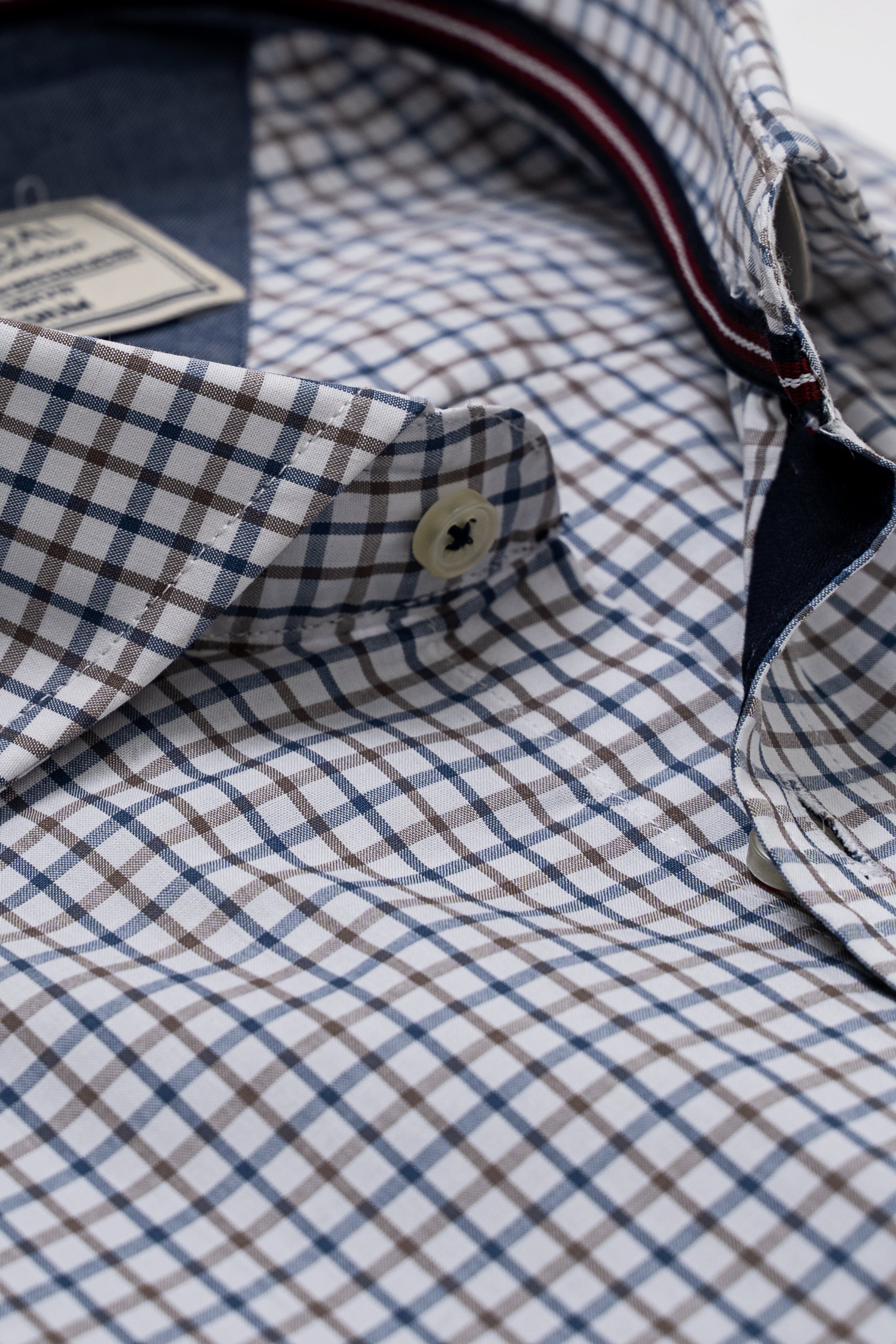 Checked shirt collar and placket with button detail and red-trim inner edge