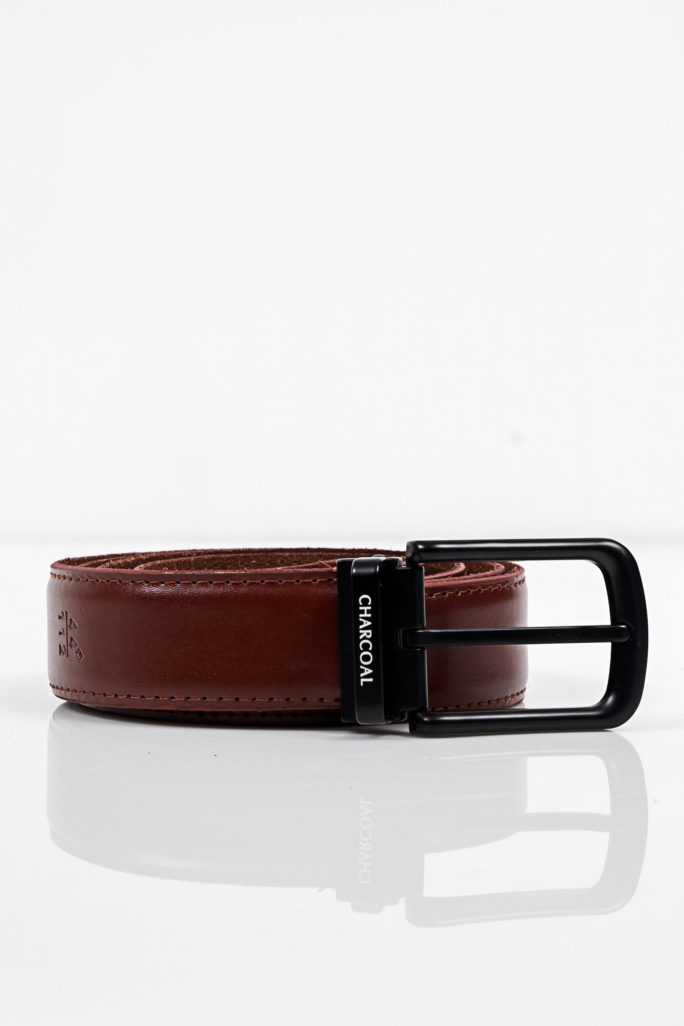 Brown leather belt with black buckle and CHACOM label on strap