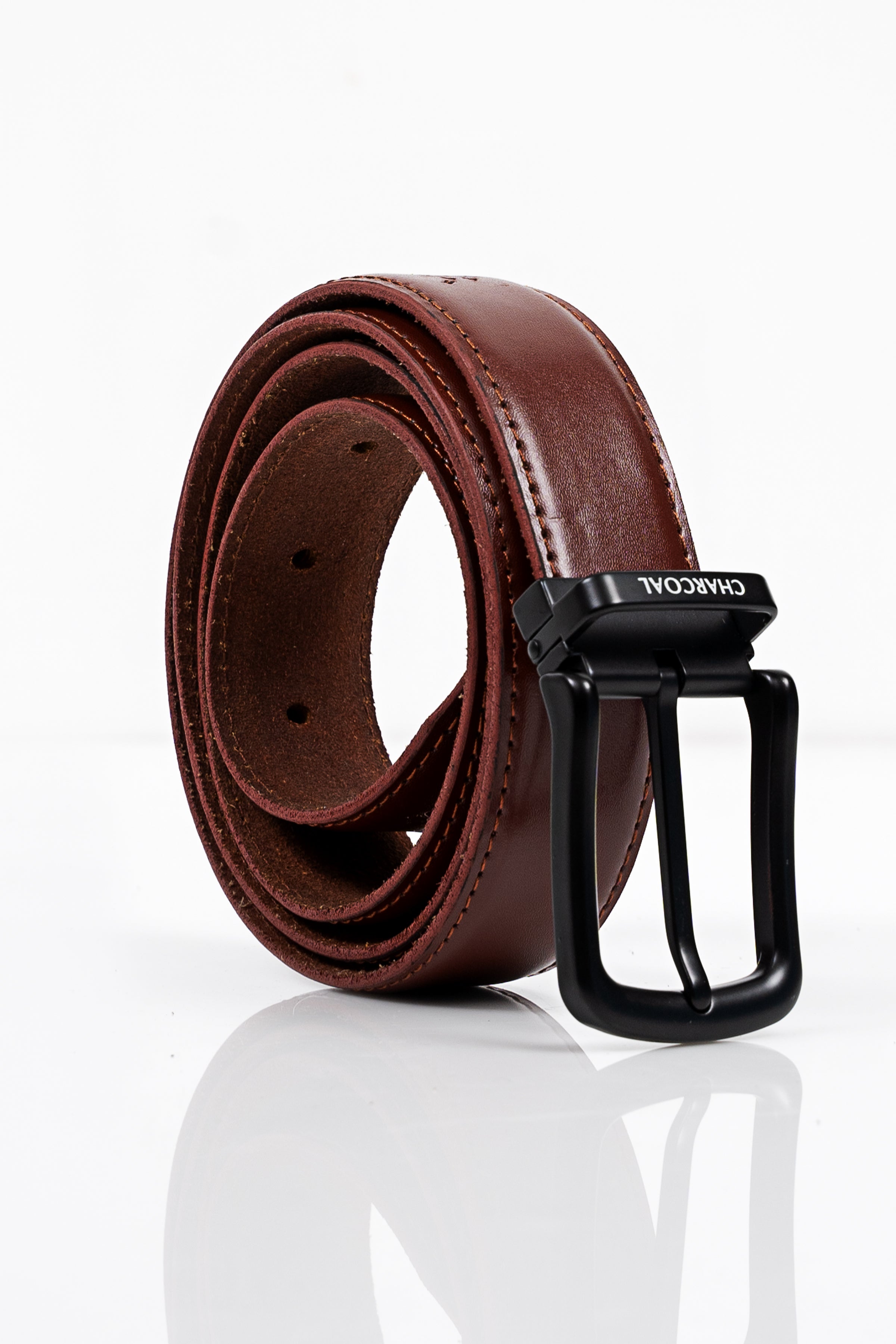 Brown leather belt with layered strap edge and black rectangular buckle