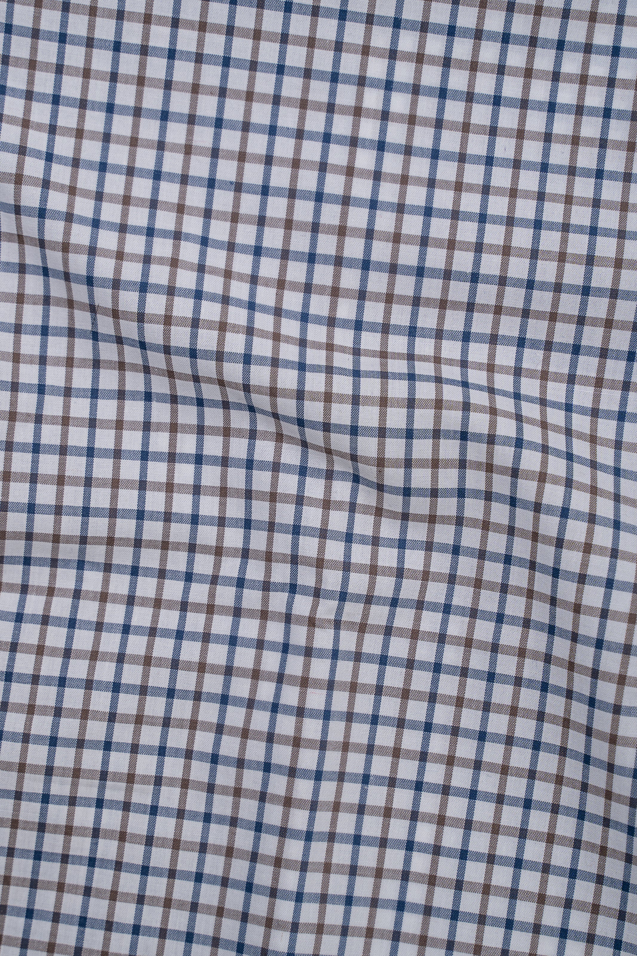Blue-and-white check shirt fabric panel with visible seam and stitching
