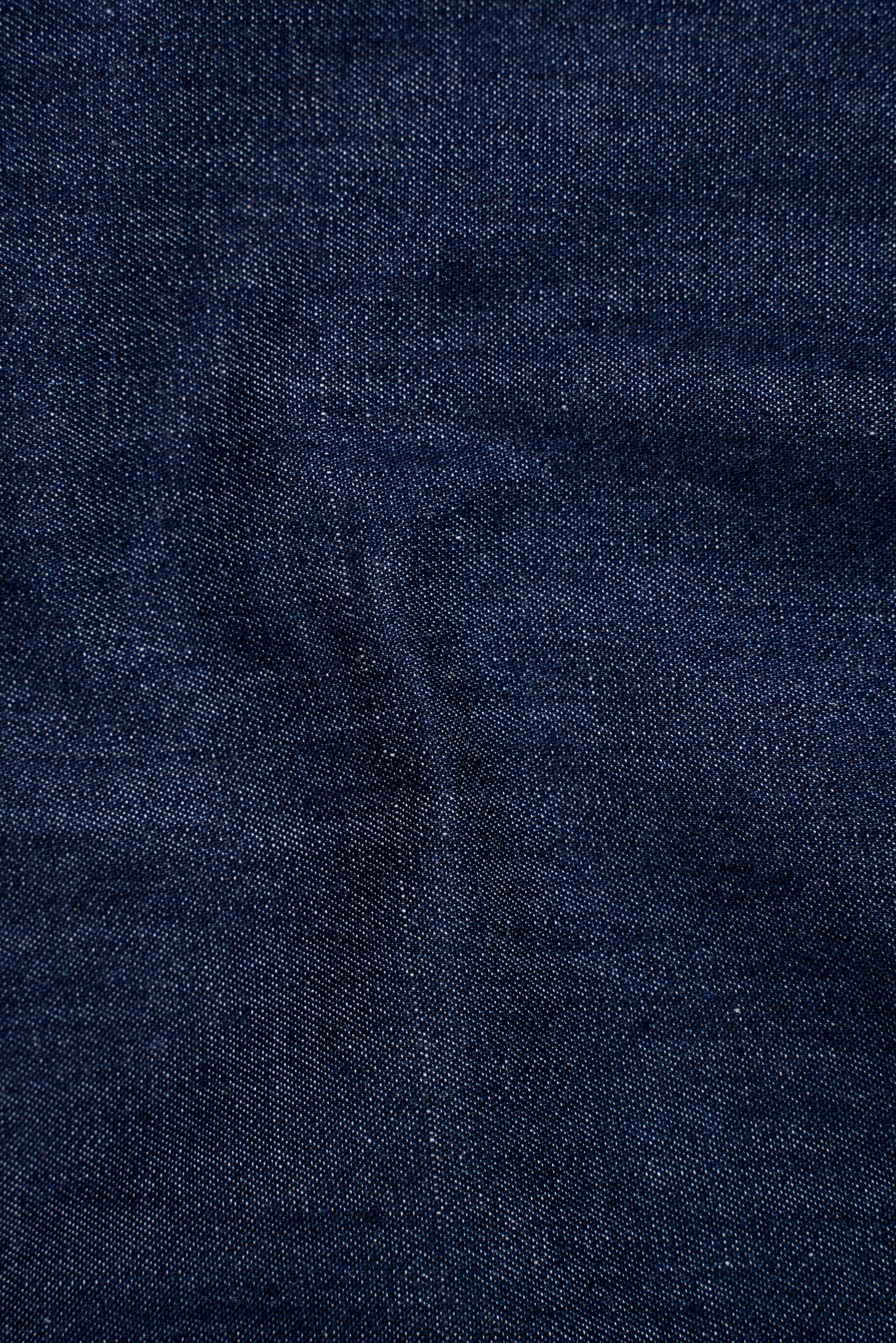 Dark blue denim fabric texture close-up
