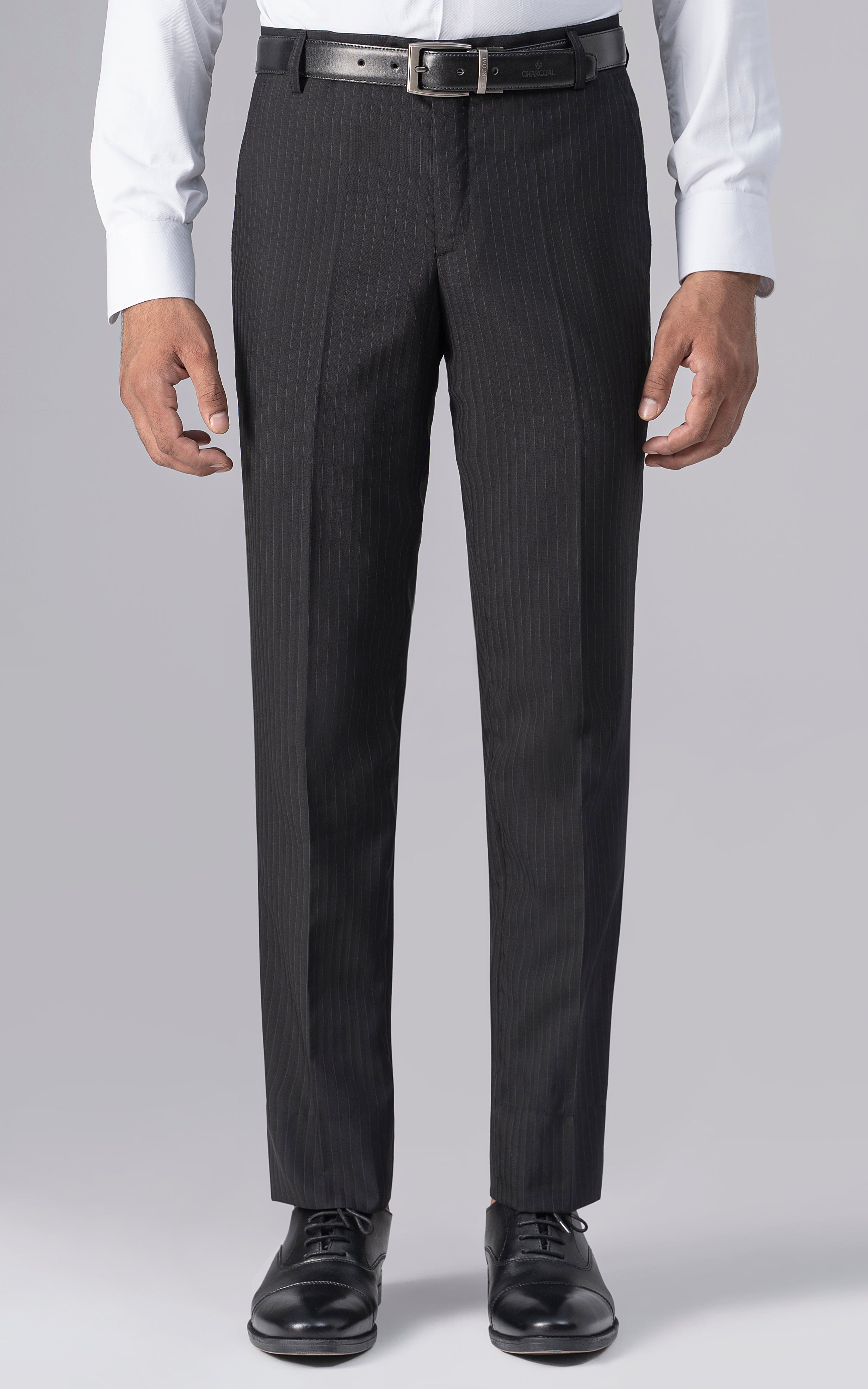 Slim-fit black dress pants with belt loops and button closure