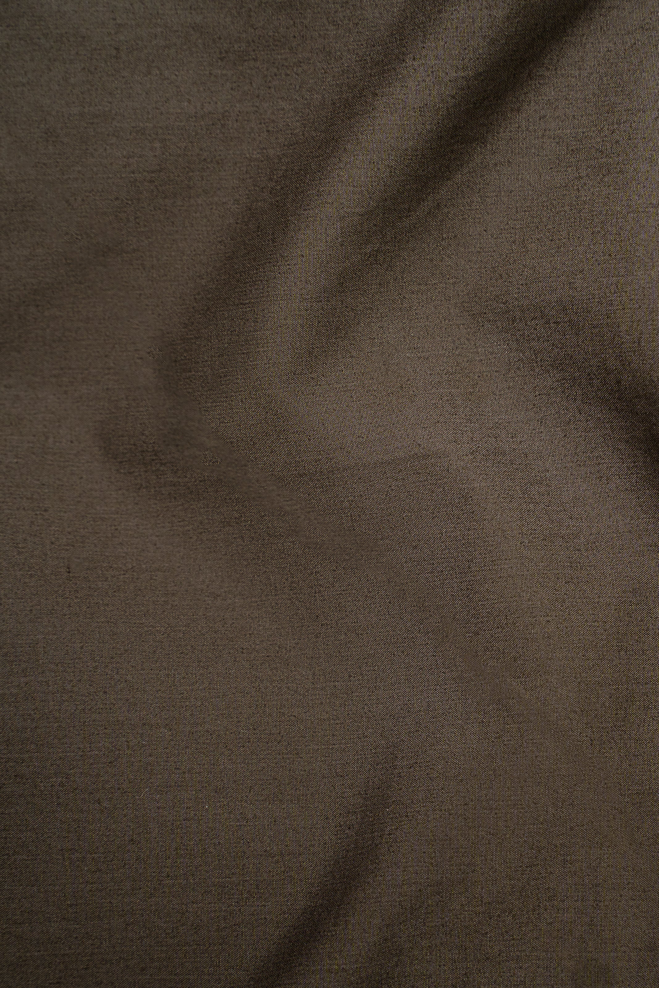 Limited edition dark olive shirt fabric texture close-up
