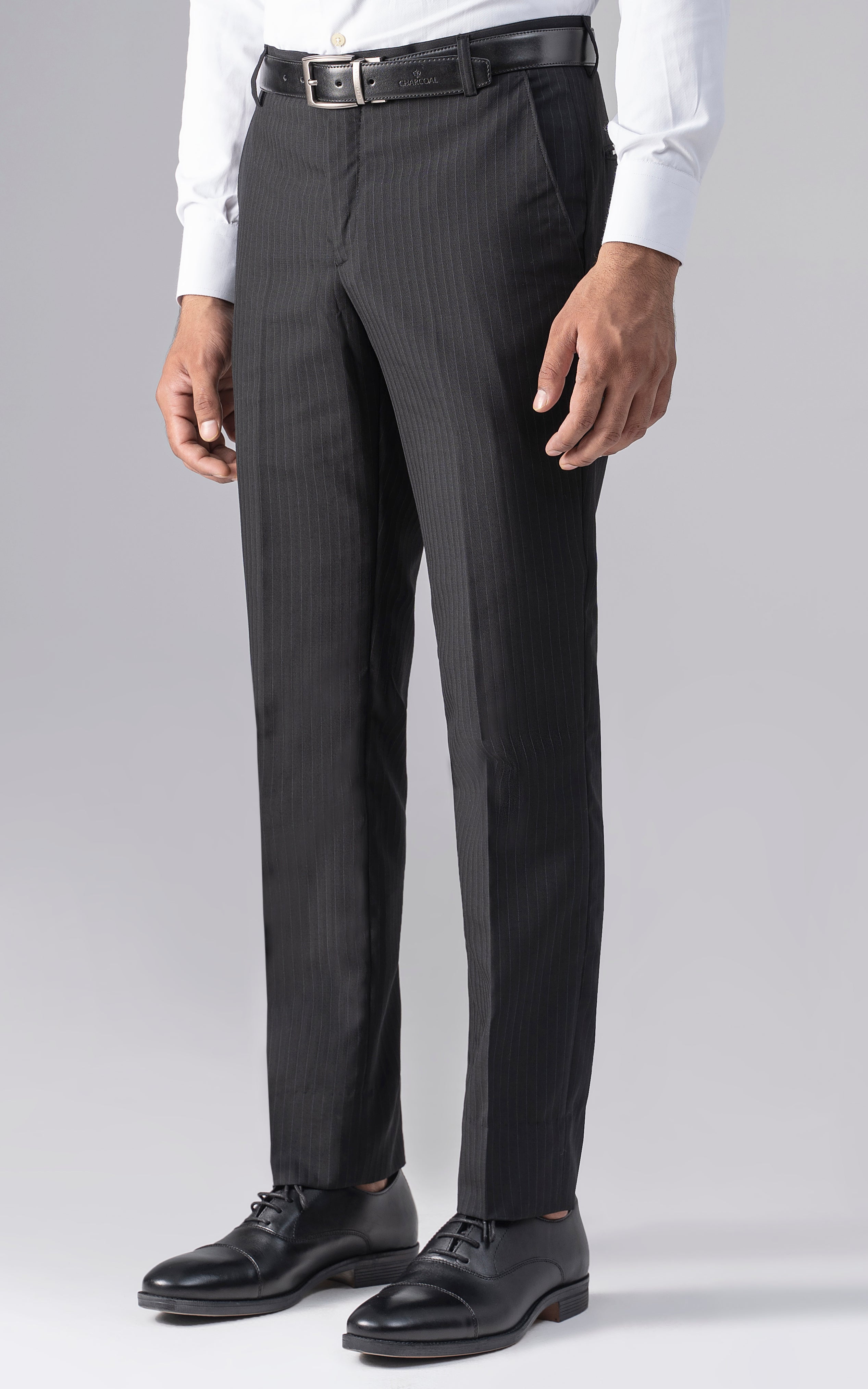Slim-fit black dress pants with belt loops and straight leg