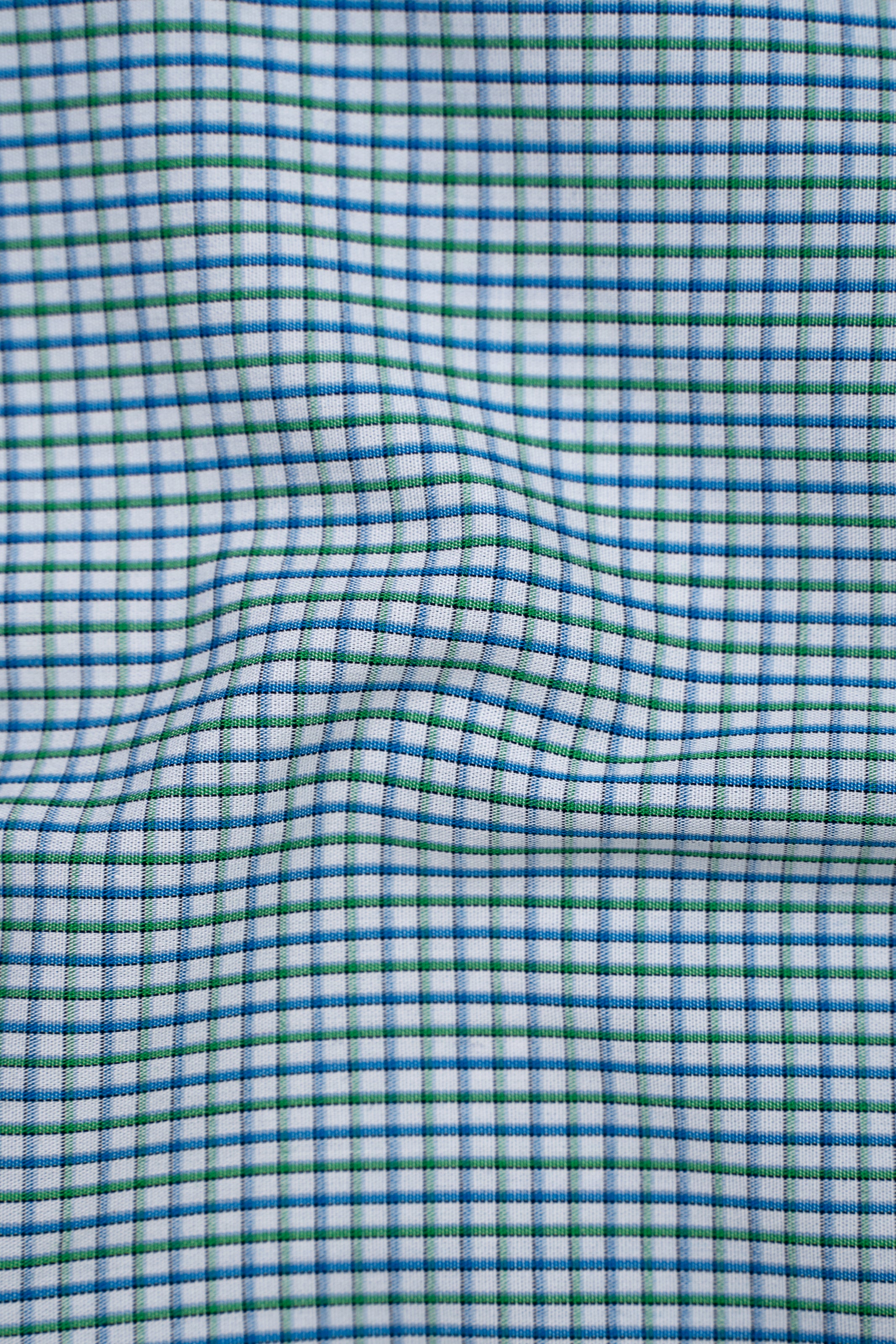 Limited edition blue-green check shirt fabric with woven grid texture