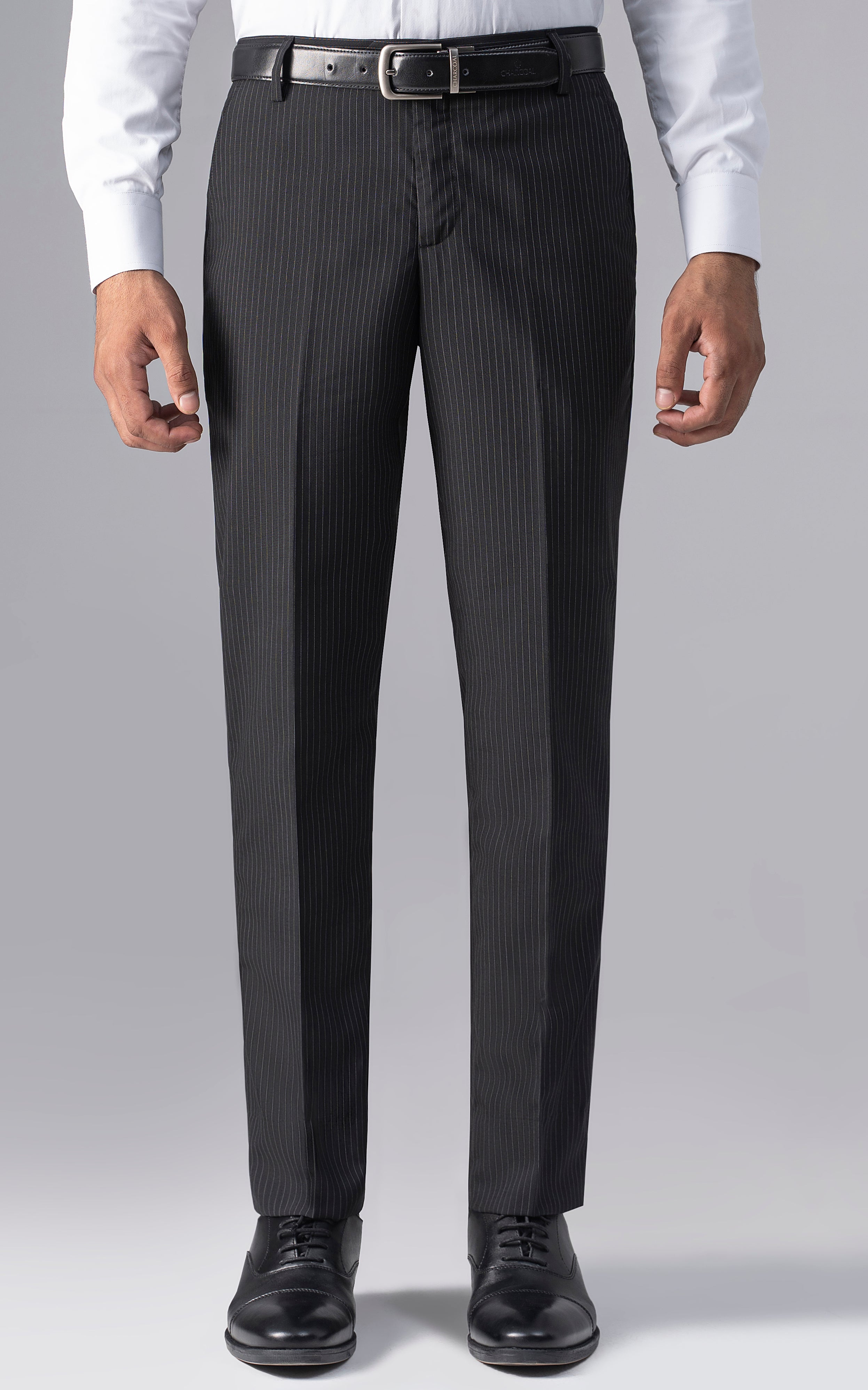 Slim-fit black dress pants with vertical pinstripes, belt loops and button closure