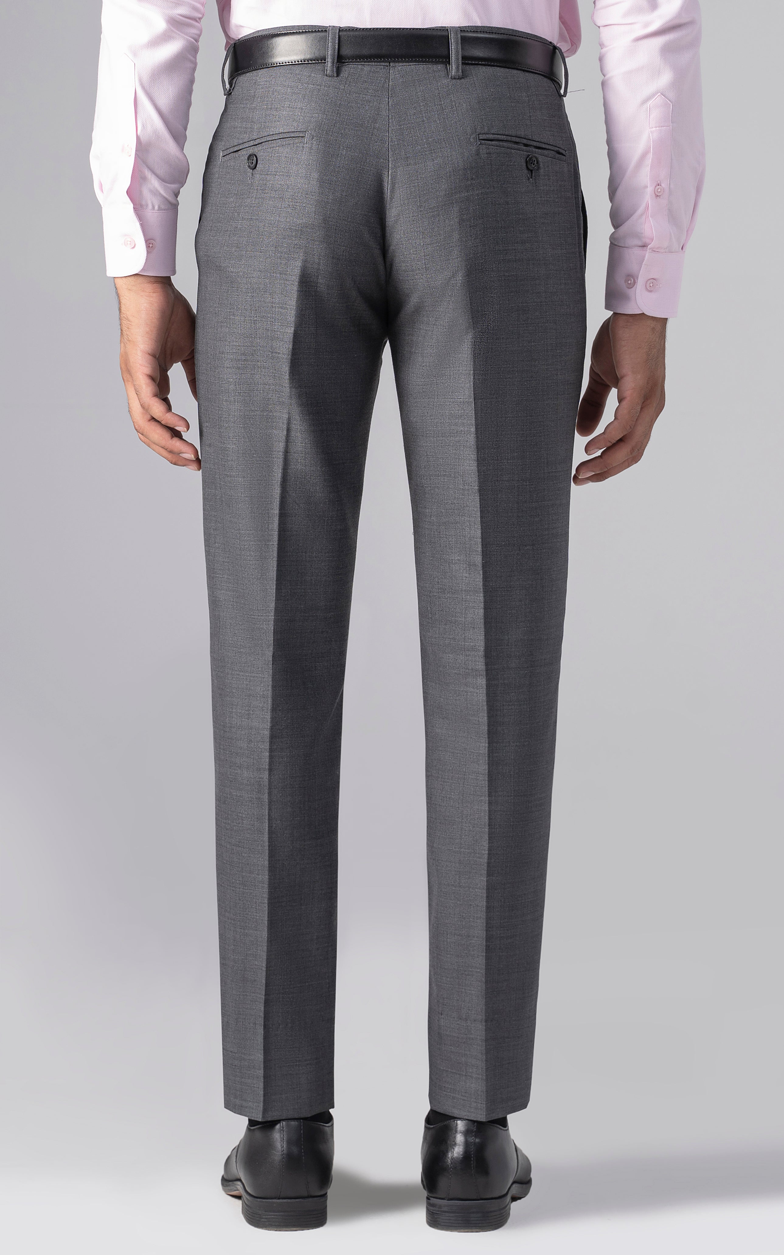 Grey slim-fit dress pants with belt loops and zip fly, front crease