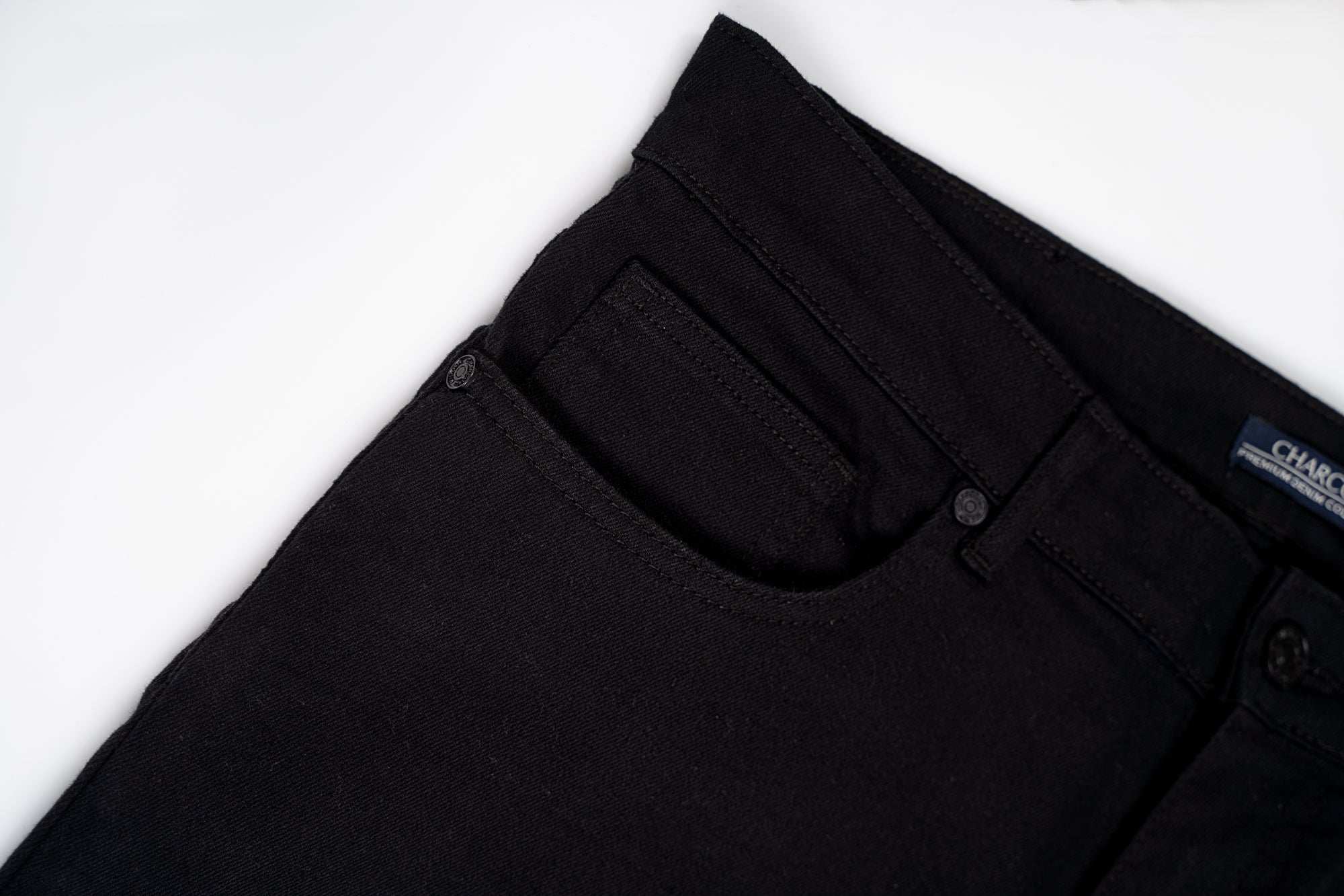 Black jeans waistband with belt loops and stitched front pocket panel