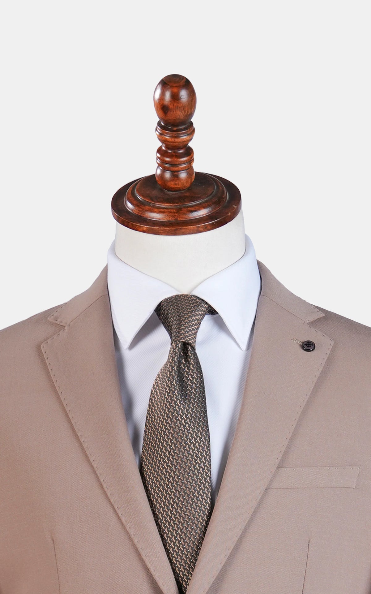 Light brown suit jacket with notch lapels and single-breasted front, close-up at neck