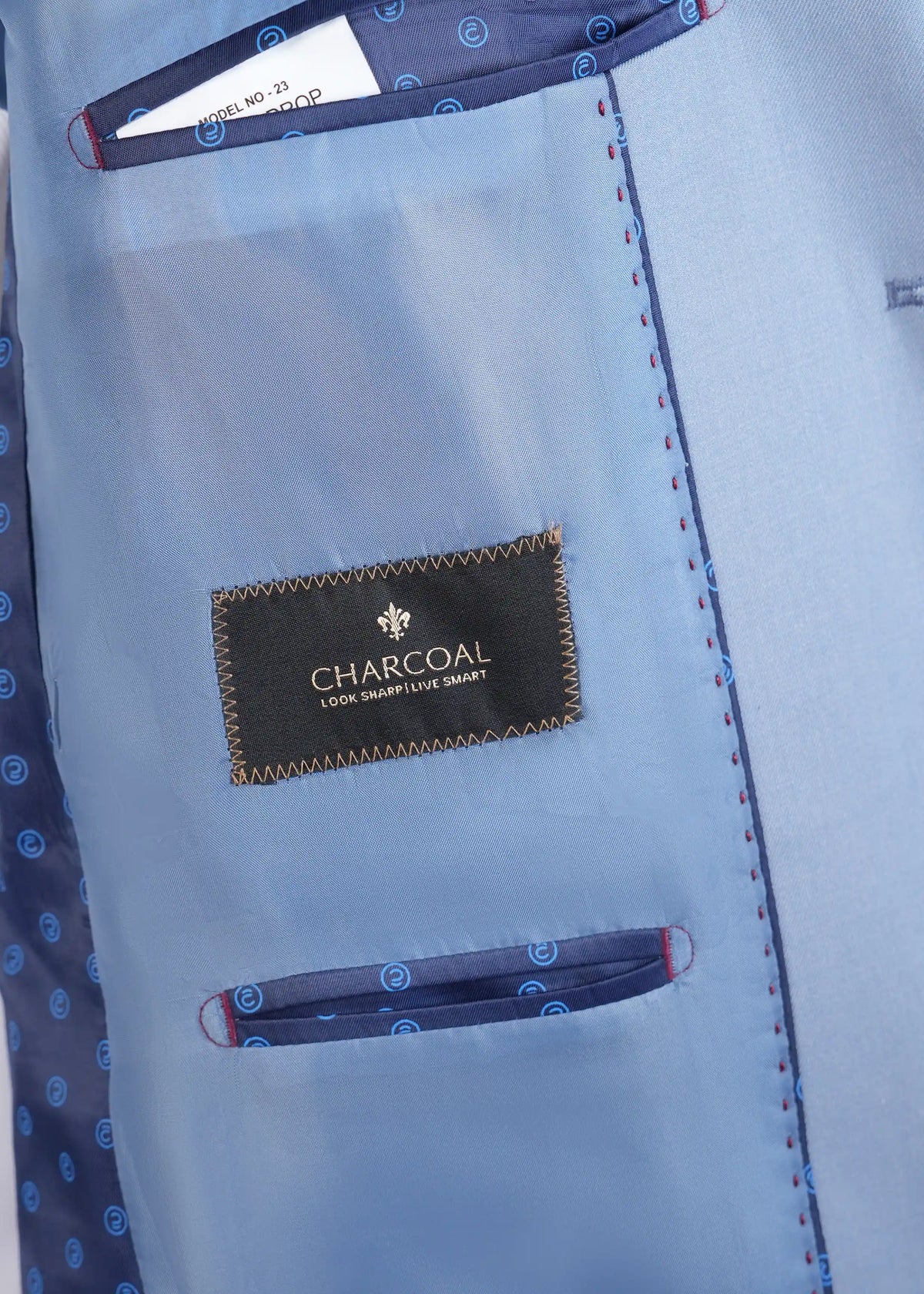 Smoke blue suit lining with Charcoal logo label and stitched inner pocket