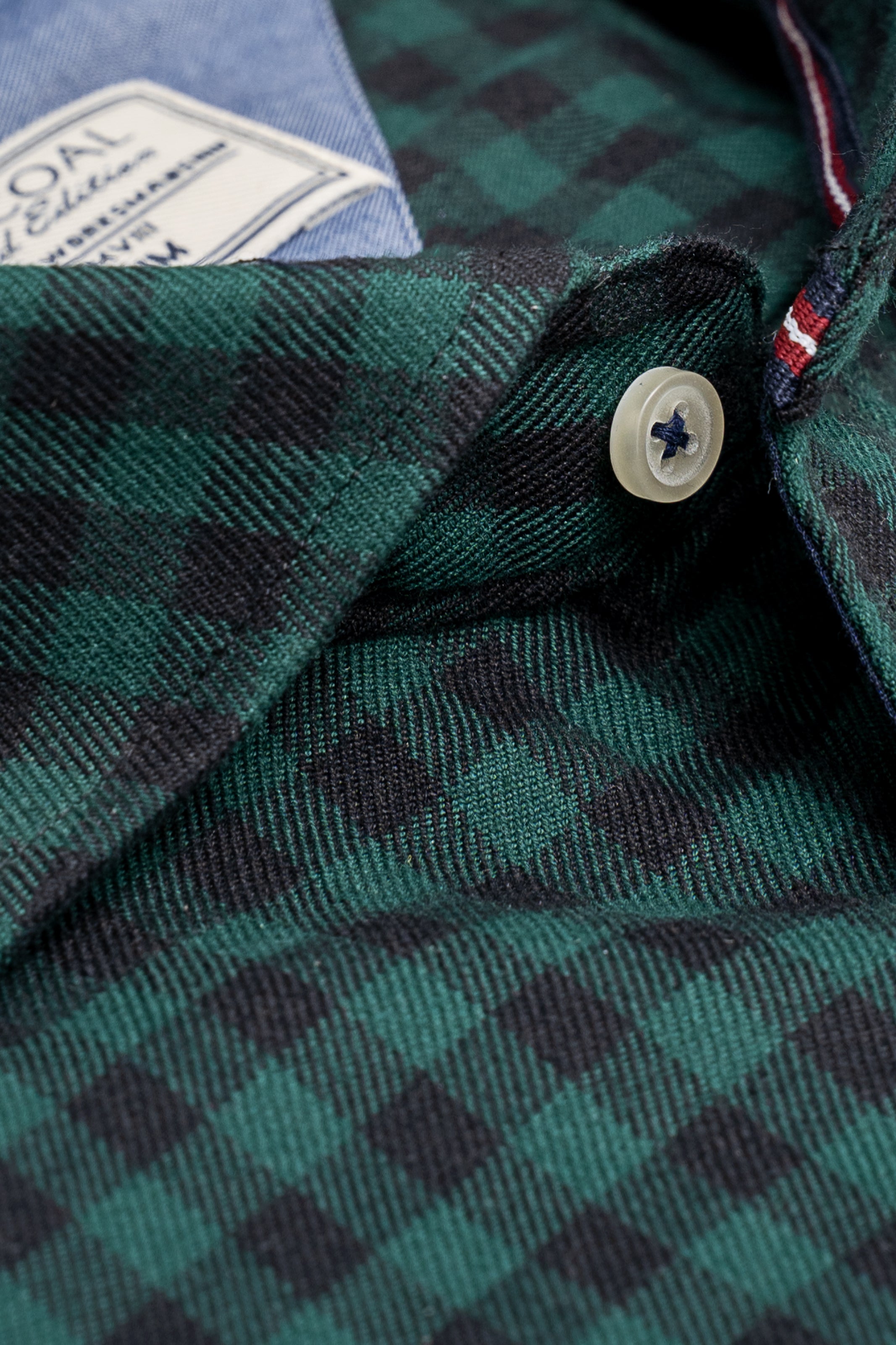 Green and black check shirt with white button detail