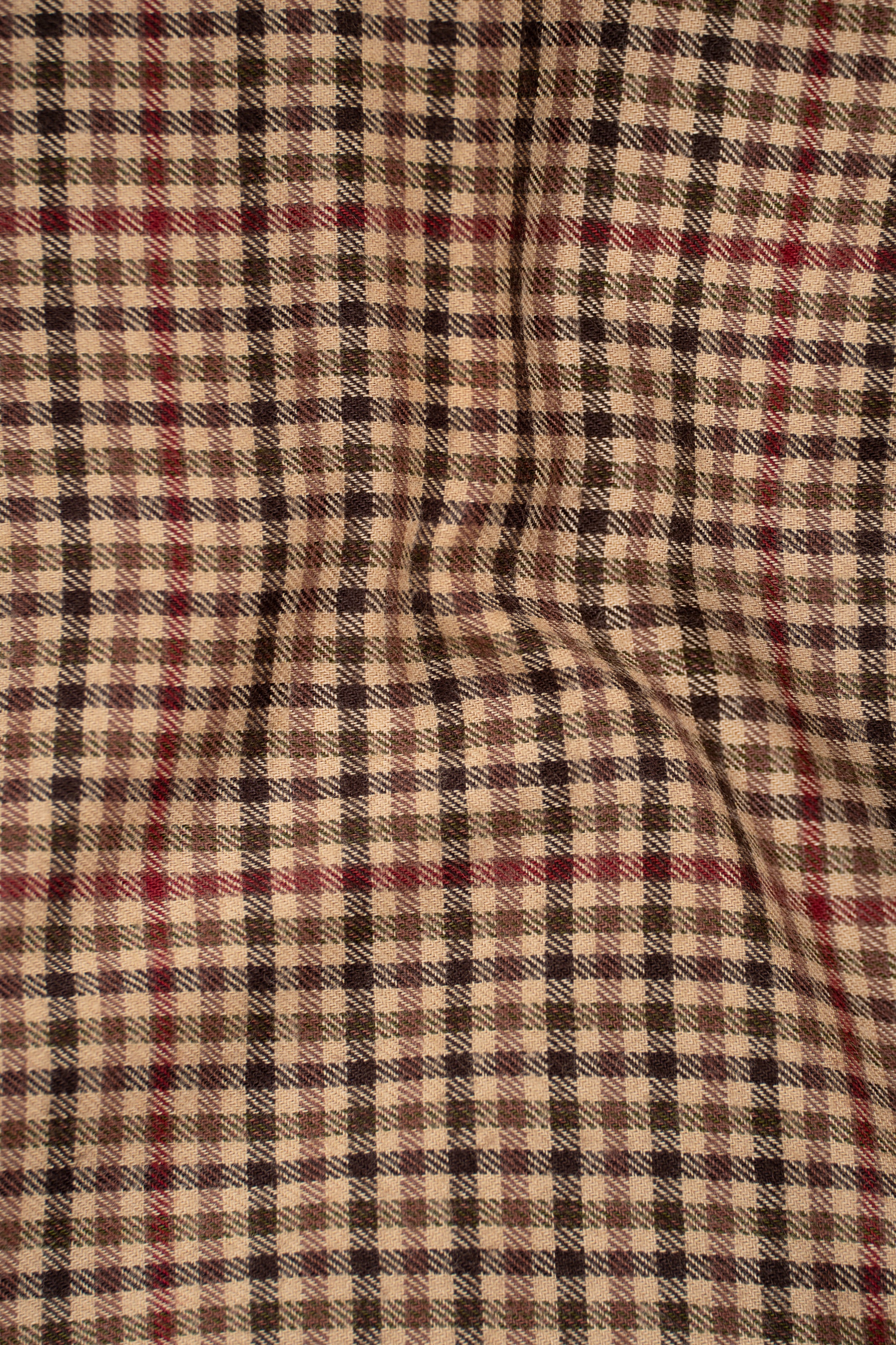 Khaki-brown check shirt fabric pattern close-up