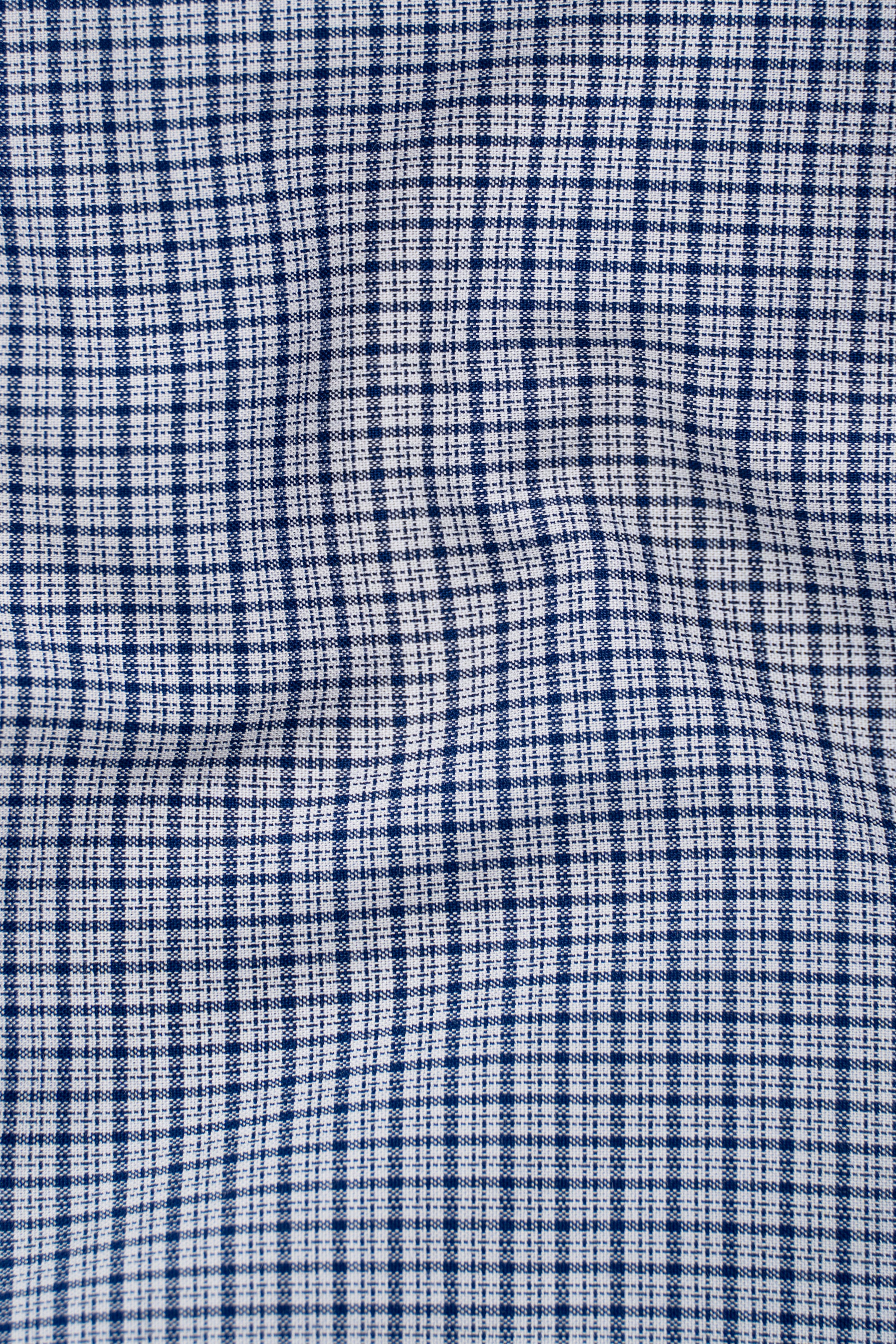 Blue and white check shirt fabric close-up