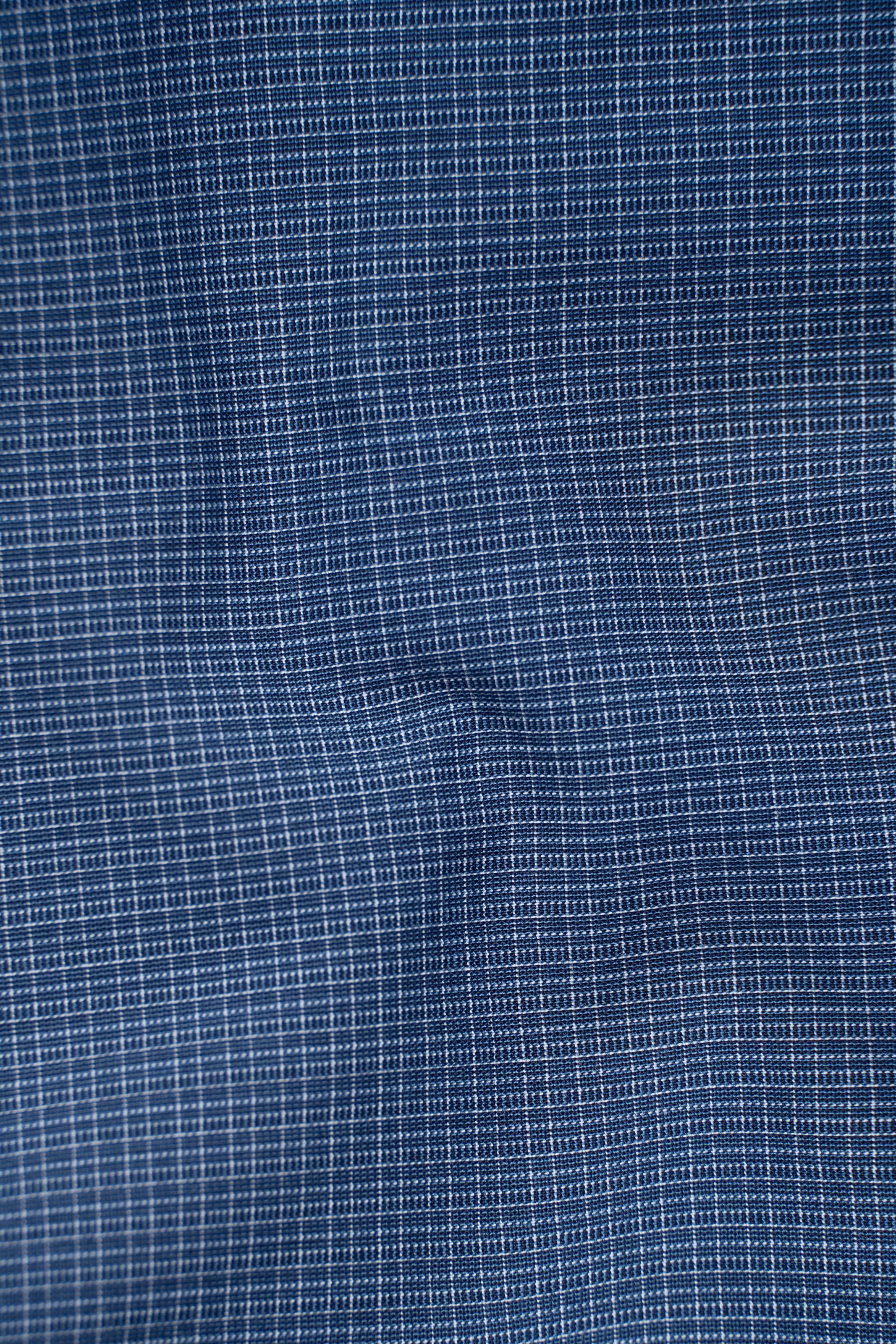 Dark blue dress shirt fabric with fine grid texture