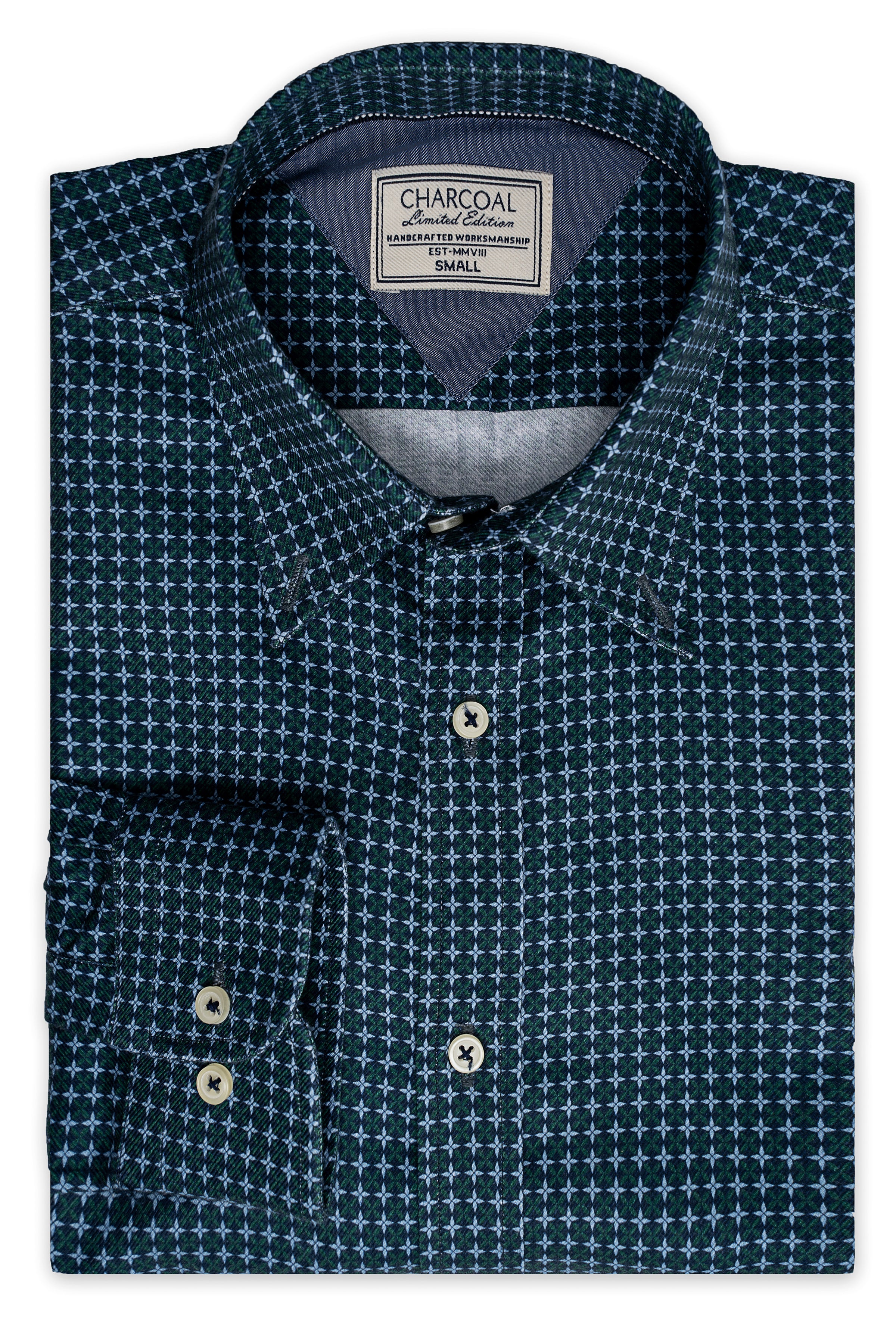 Limited edition shirt in dark teal with green and white geometric print, button placket
