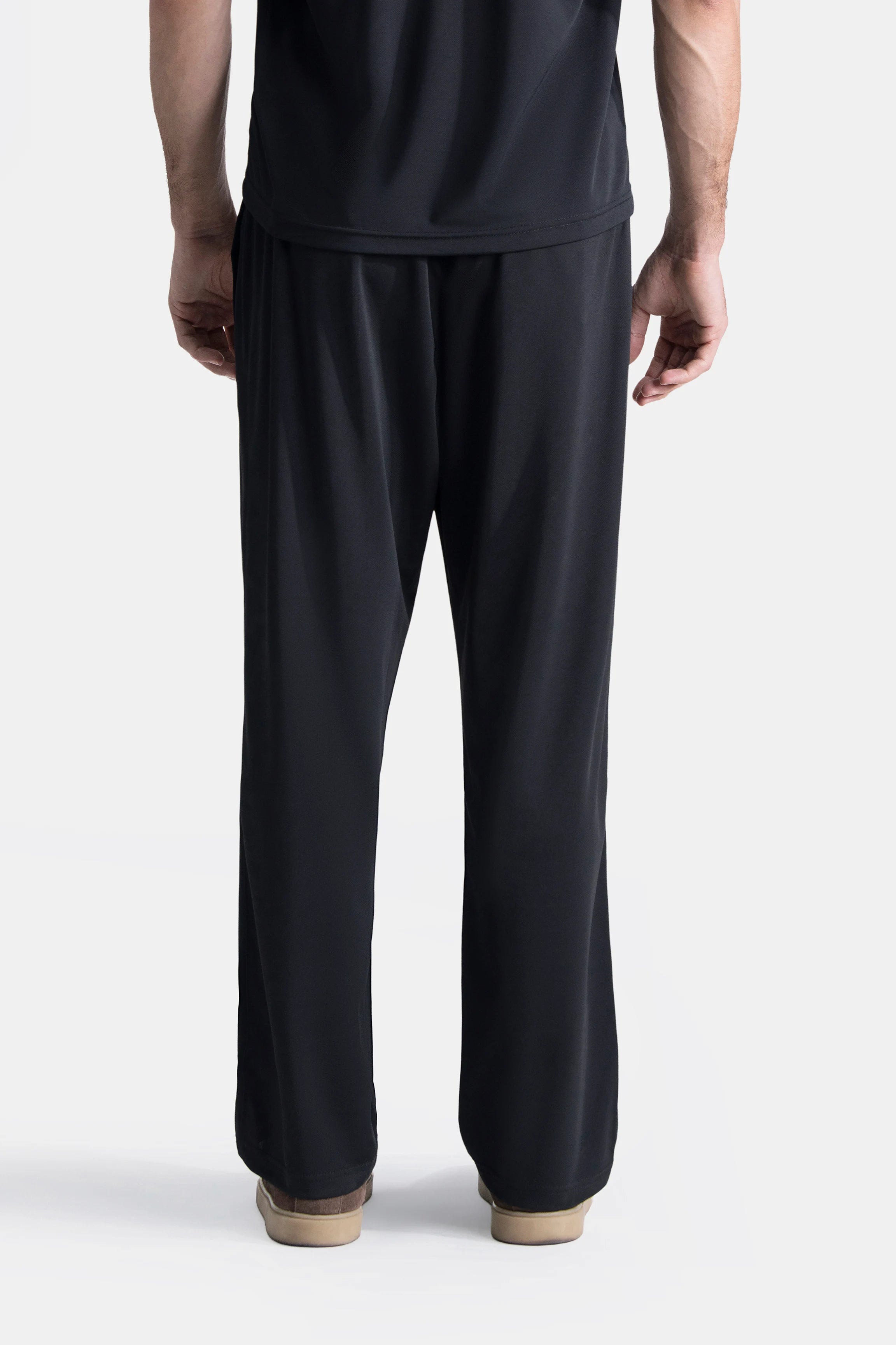 Black loose-fit trousers with elasticated waistband and straight leg opening