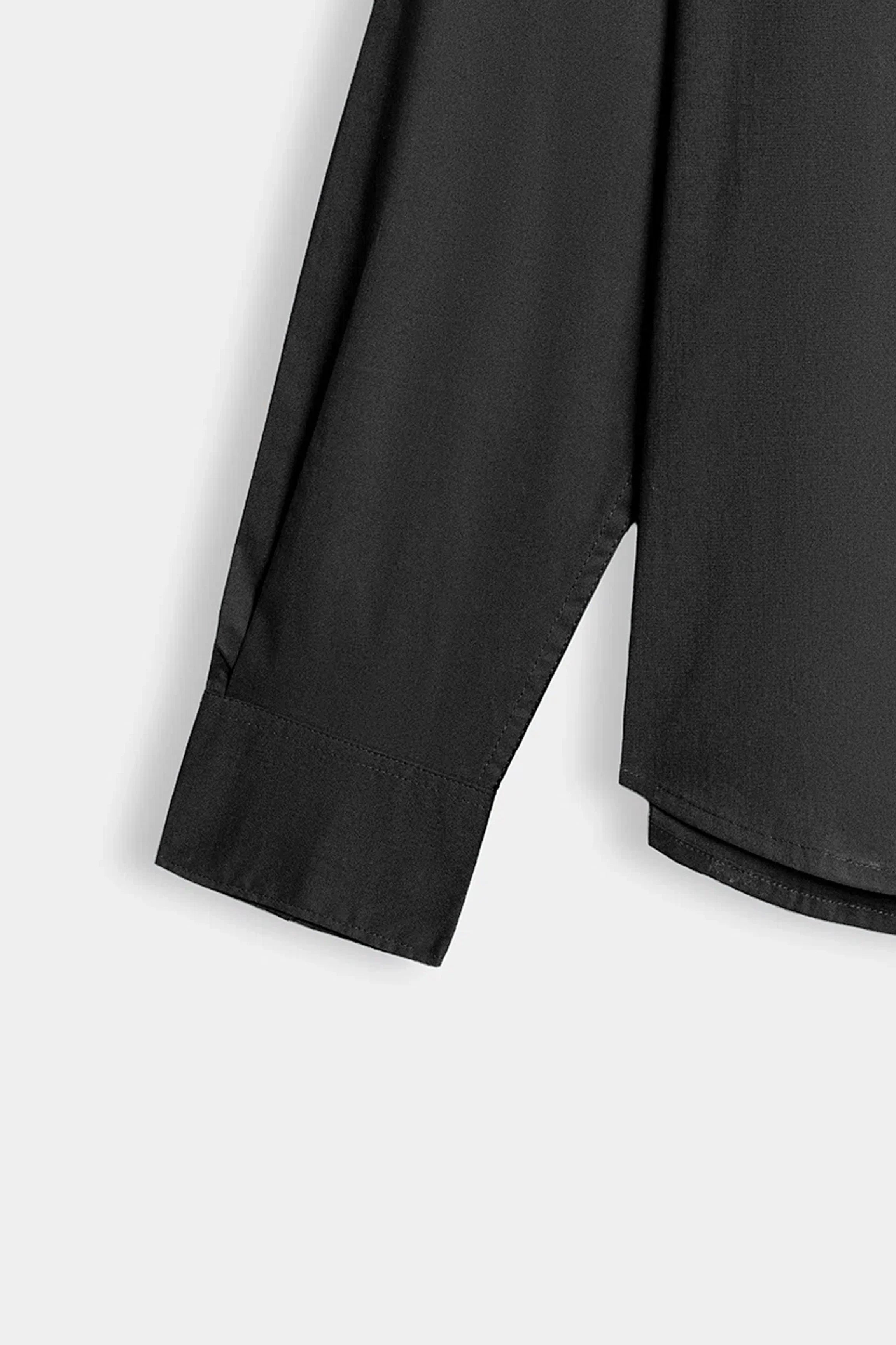 Dark charcoal shirt sleeve and hem, buttoned cuff