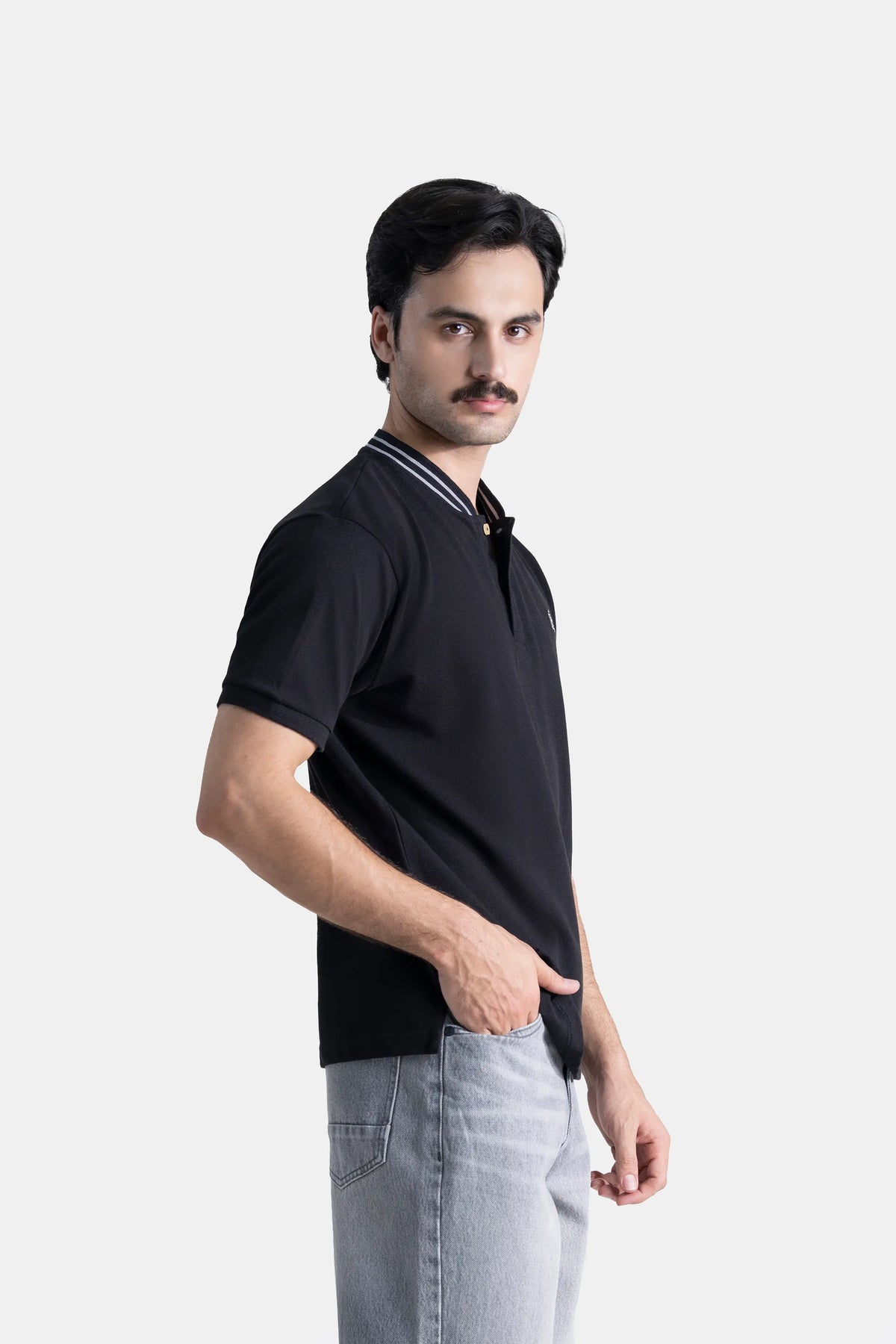 Black short-sleeve henley shirt, side view, striped neckline and button placket