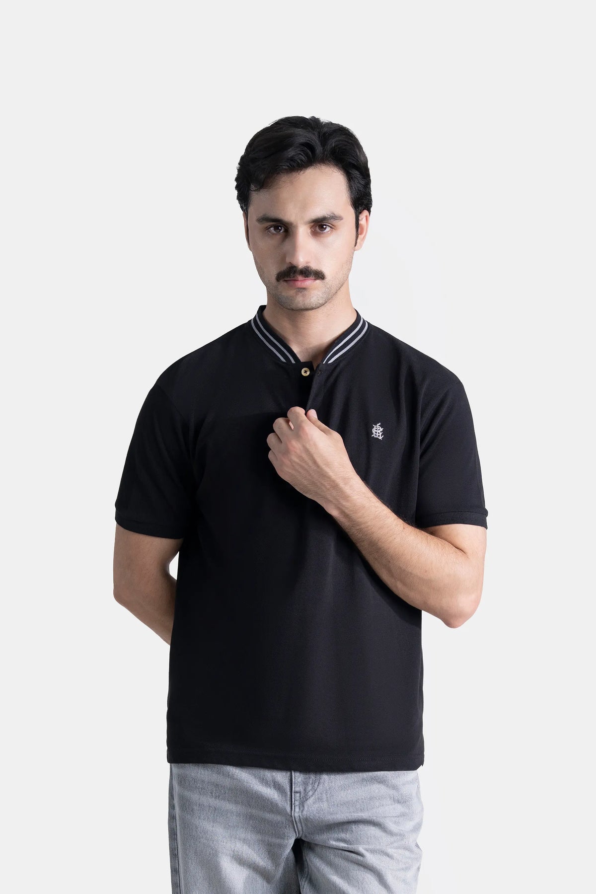 Black short-sleeve henley shirt with striped collar trim and small chest logo