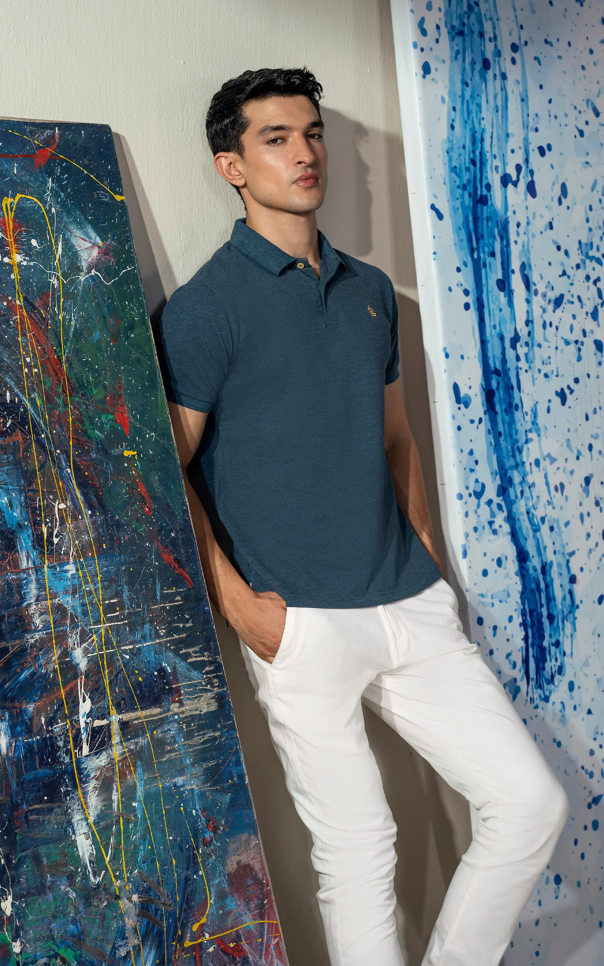 Teal blue short-sleeve polo shirt with collar and small chest logo
