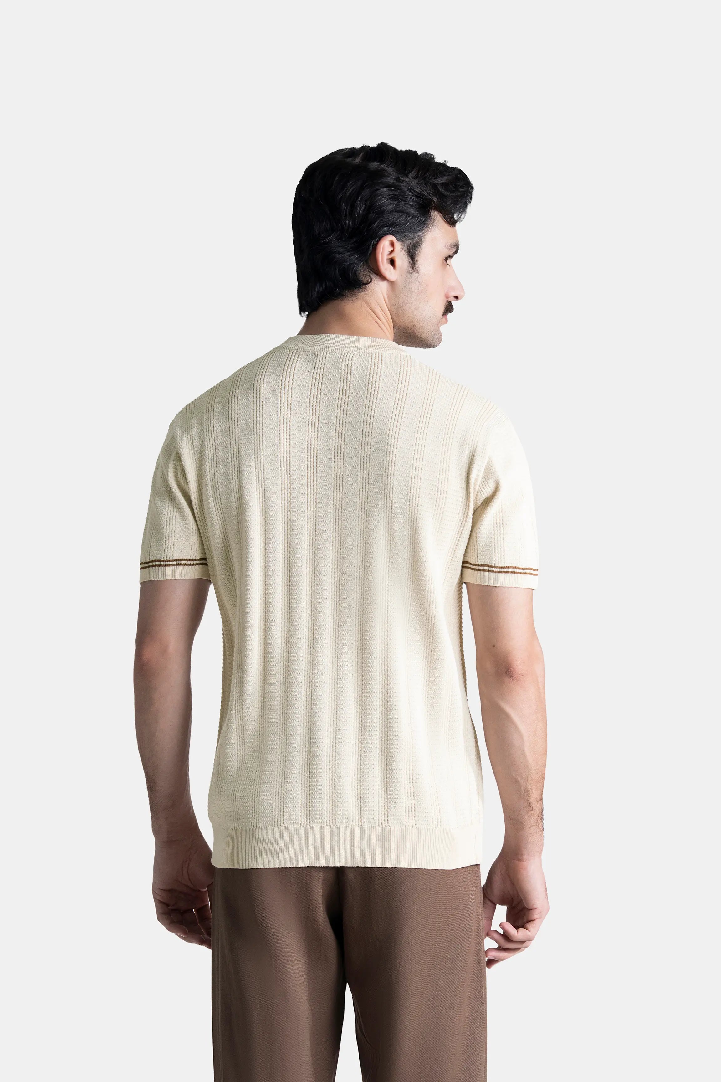 Beige crew neck T-shirt with cable-knit texture; short sleeves and ribbed trim at cuffs.
