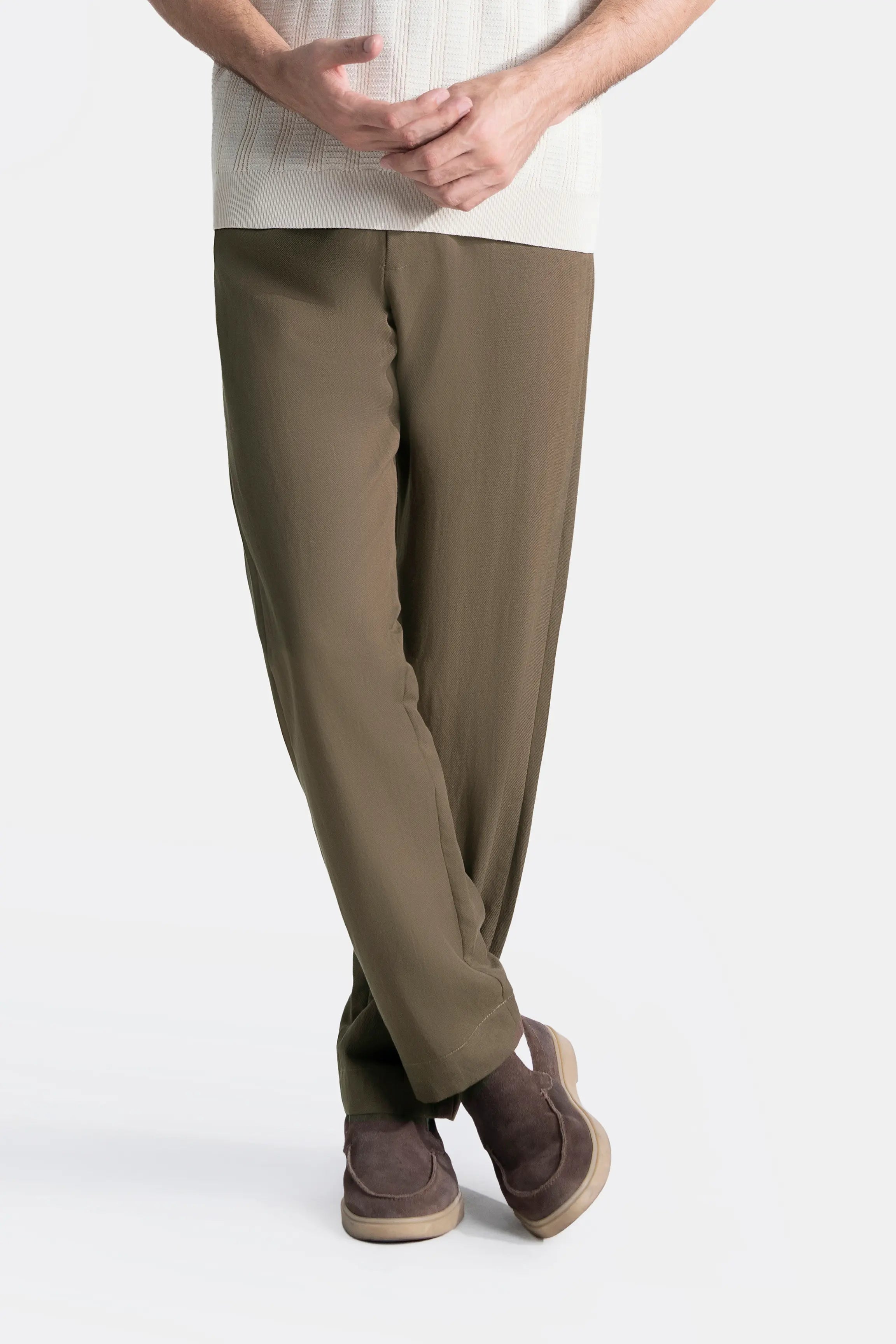 Straight-fit brown pants with ankle-length hem and visible leg seam