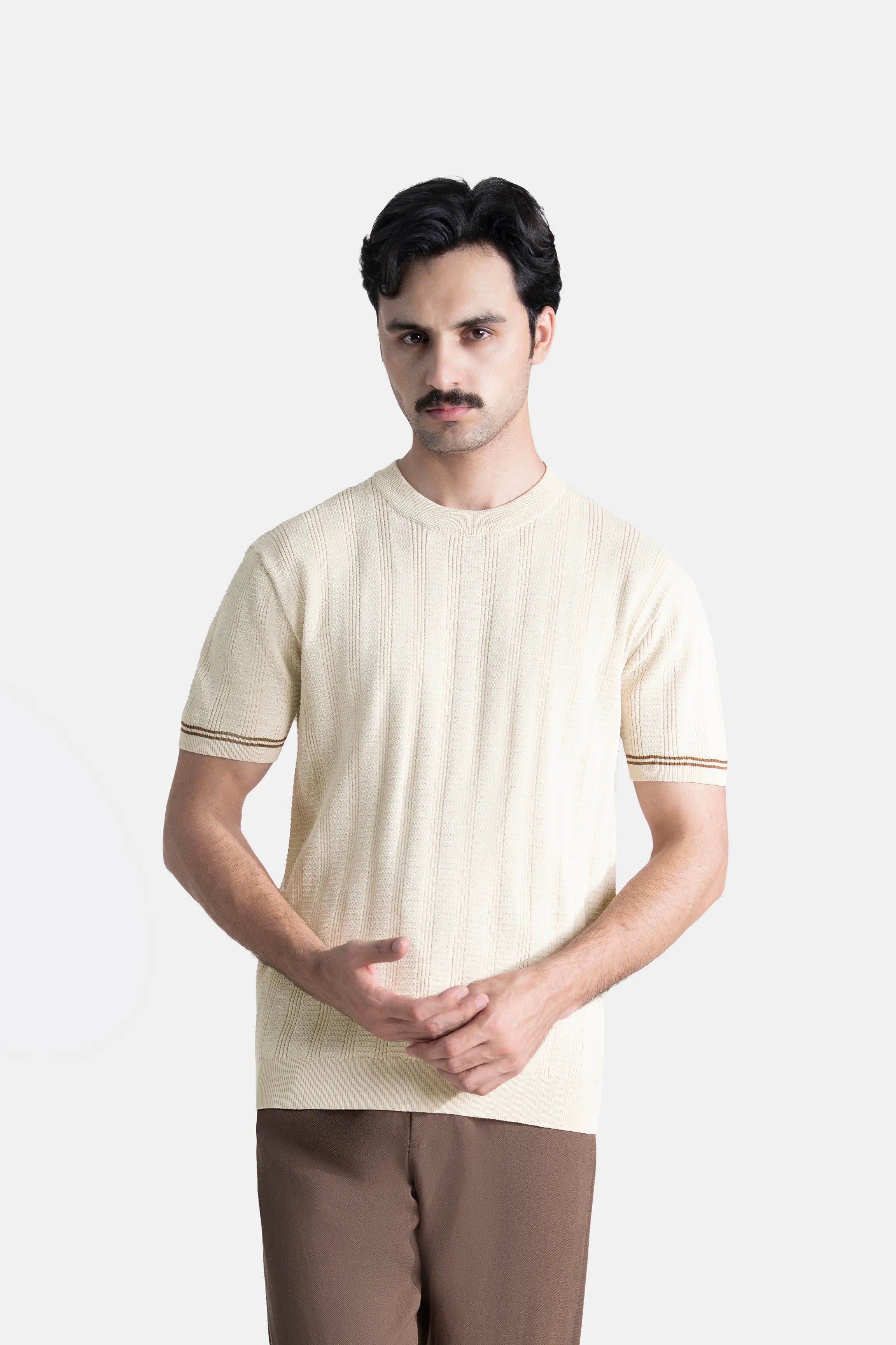 Beige cable-knit crew neck T-shirt with striped rib trim at sleeves, straight hem.