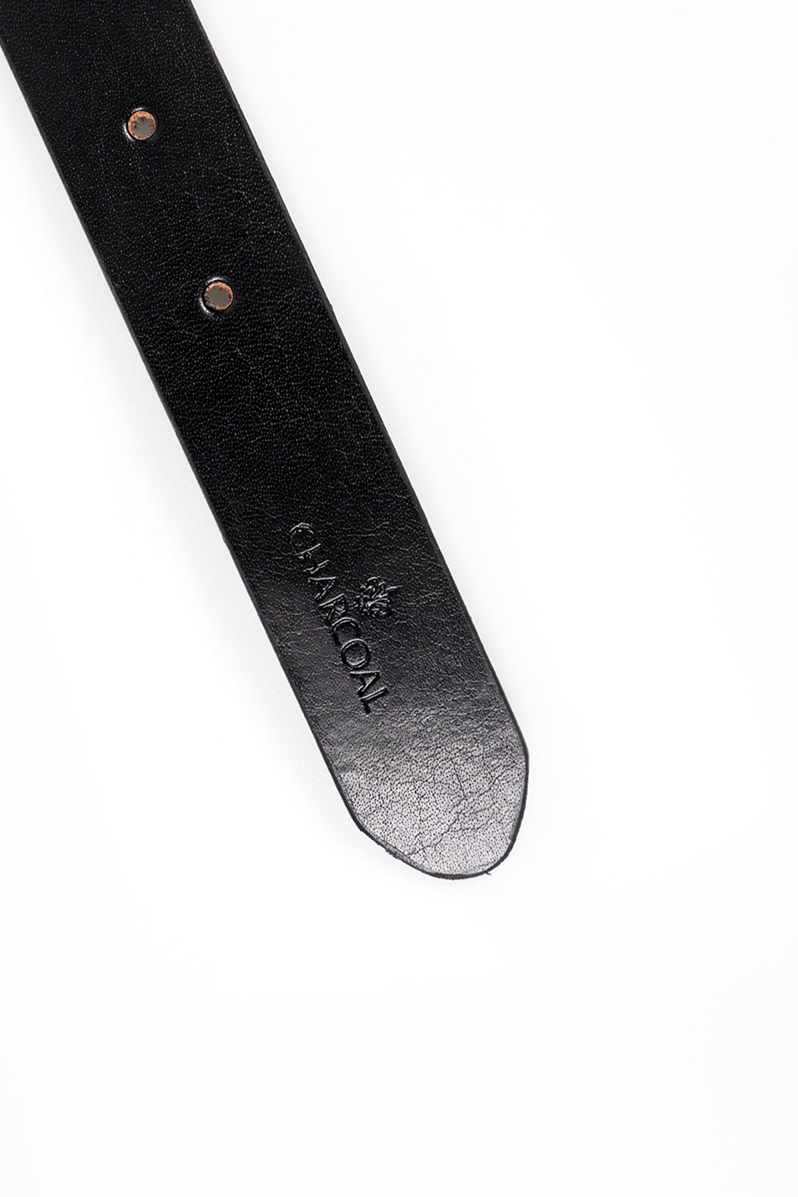 Black leather belt strap close-up with embossed branding and rivet holes