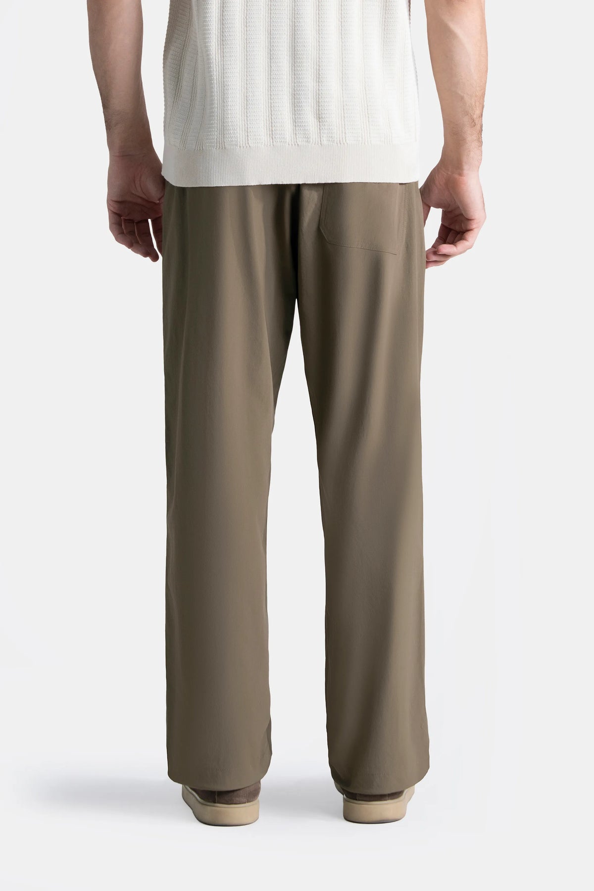 Olive loose-fit casual trousers from the back with relaxed straight leg fit