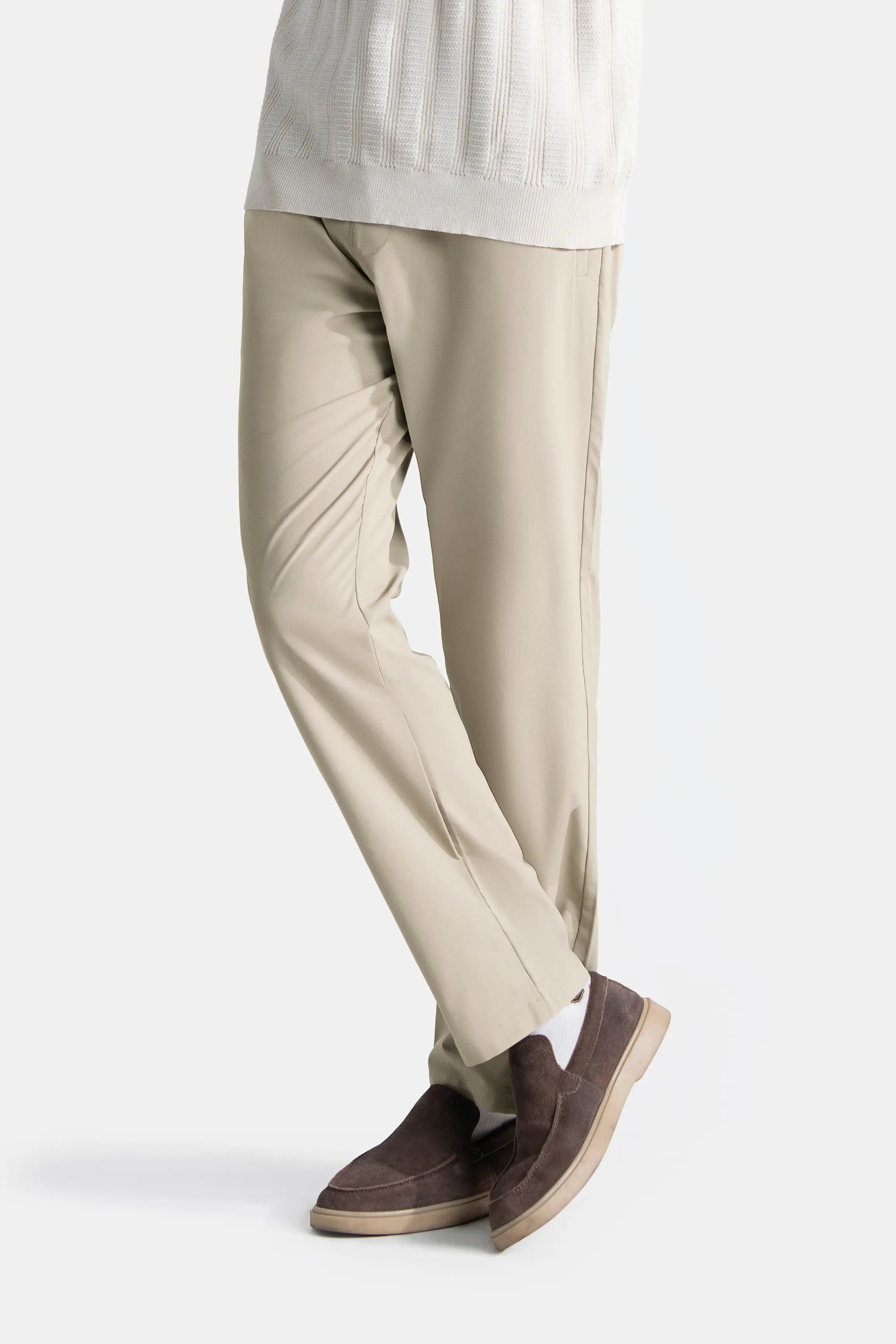 Beige straight-fit casual trousers side view with ankle hem and crease
