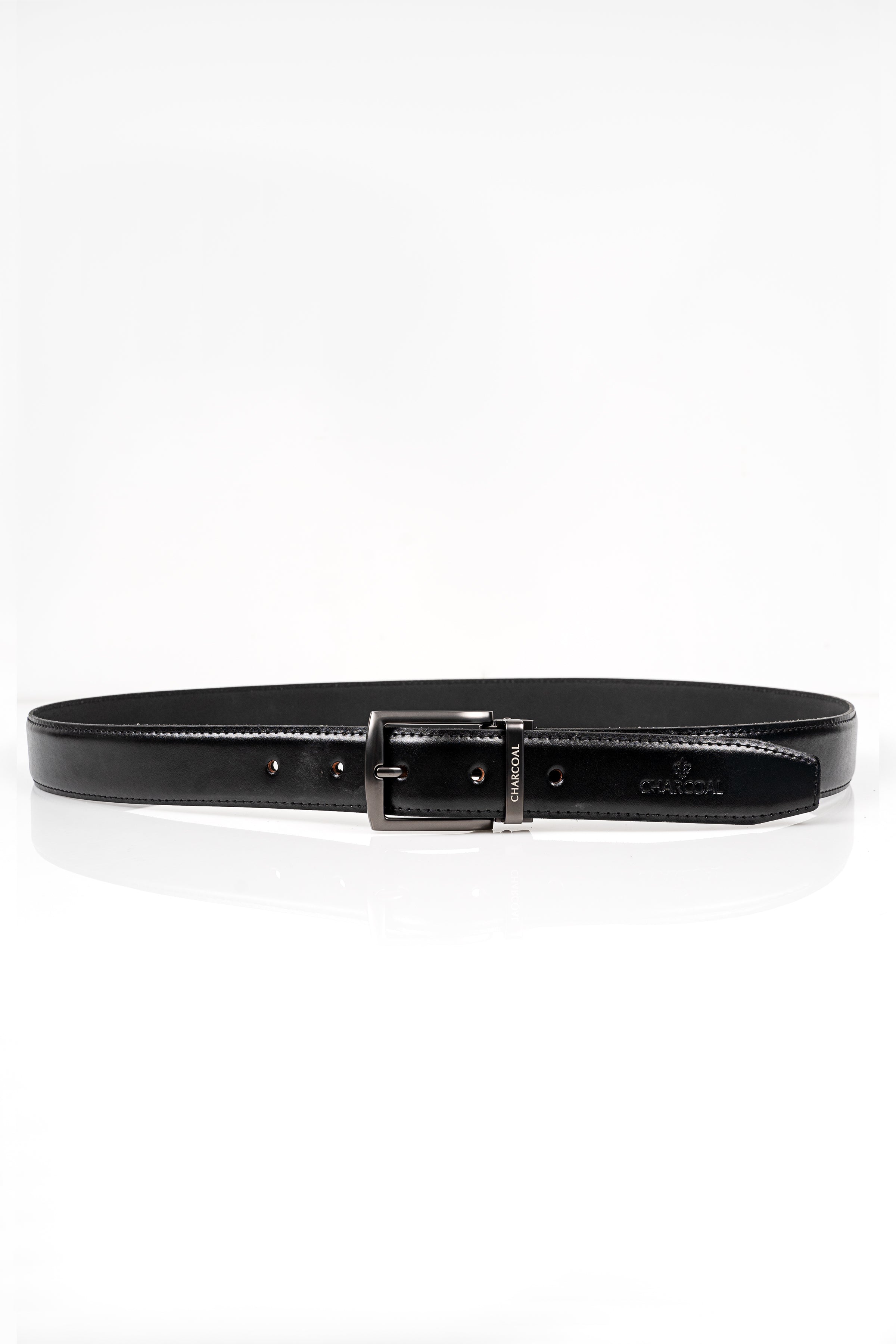 Black leather belt with silver buckle and engraved detailing, laid flat.