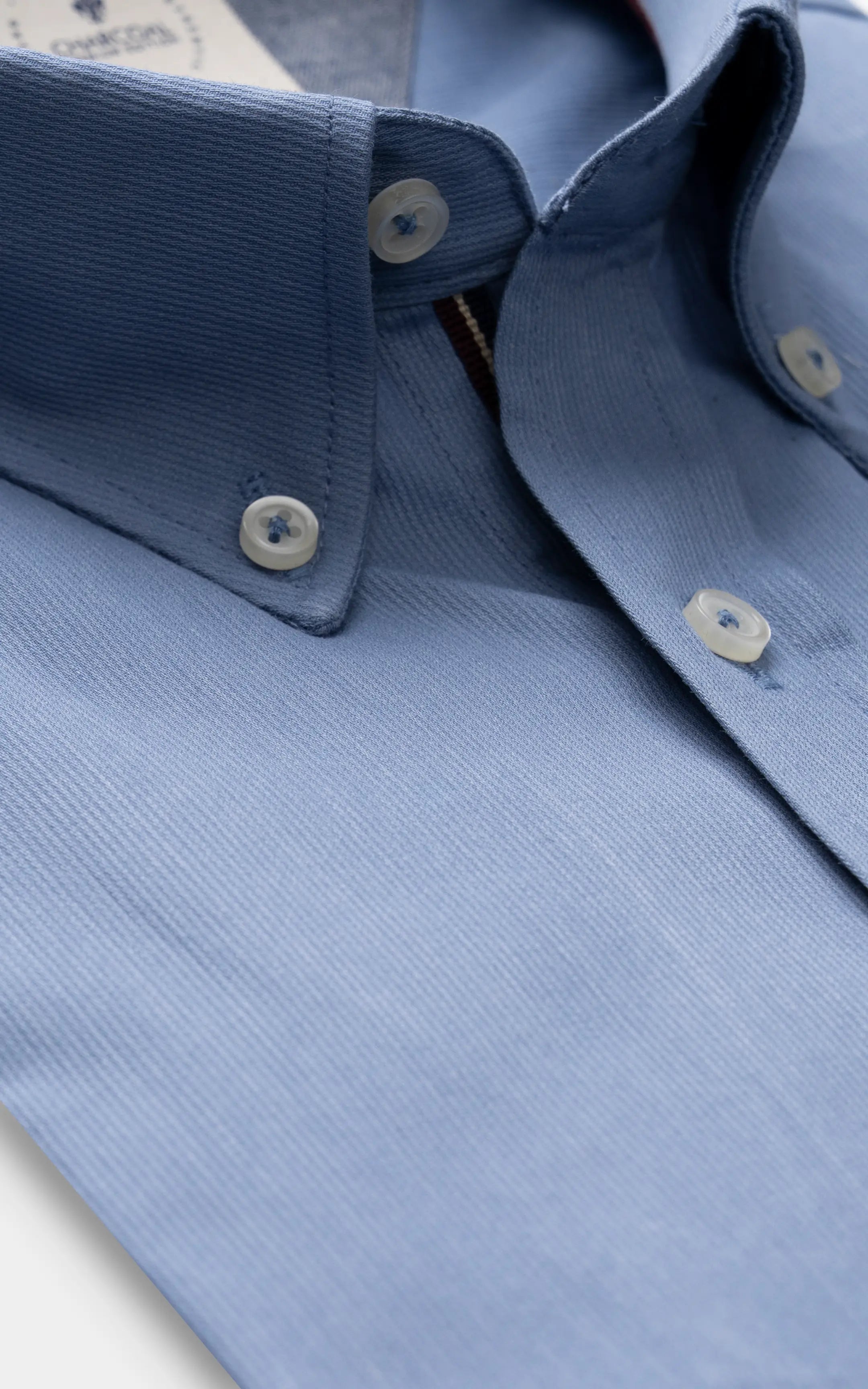Sky blue dress shirt cuff with button and stitched placket detail