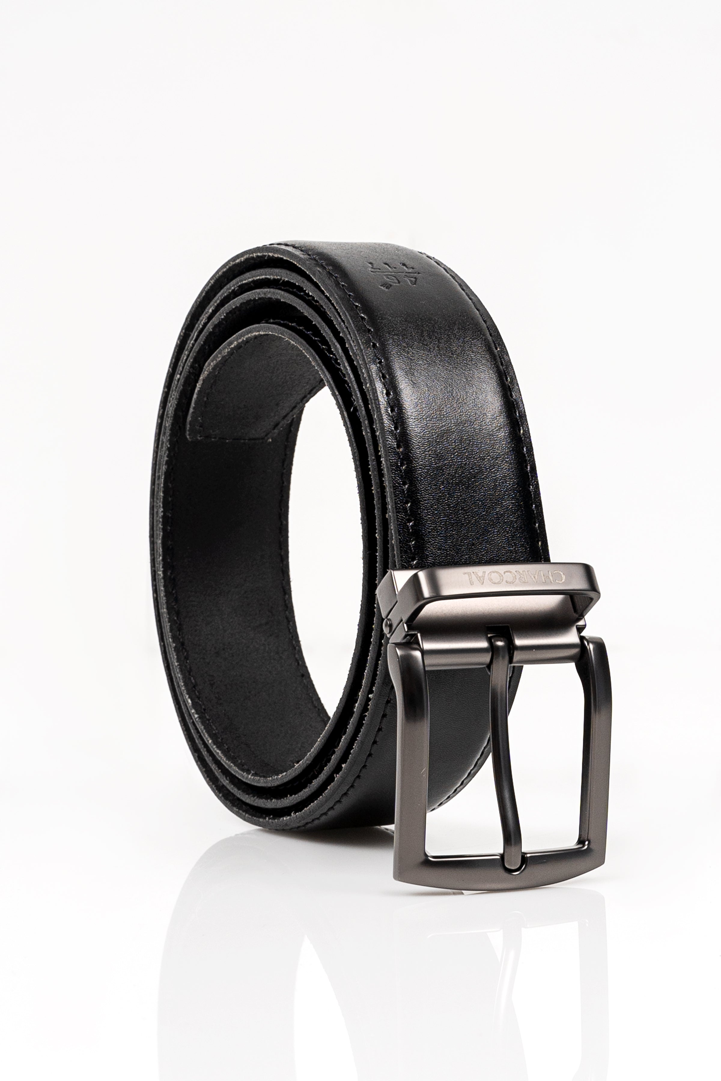 Black leather belt with silver buckle and stitched edge, curled profile.