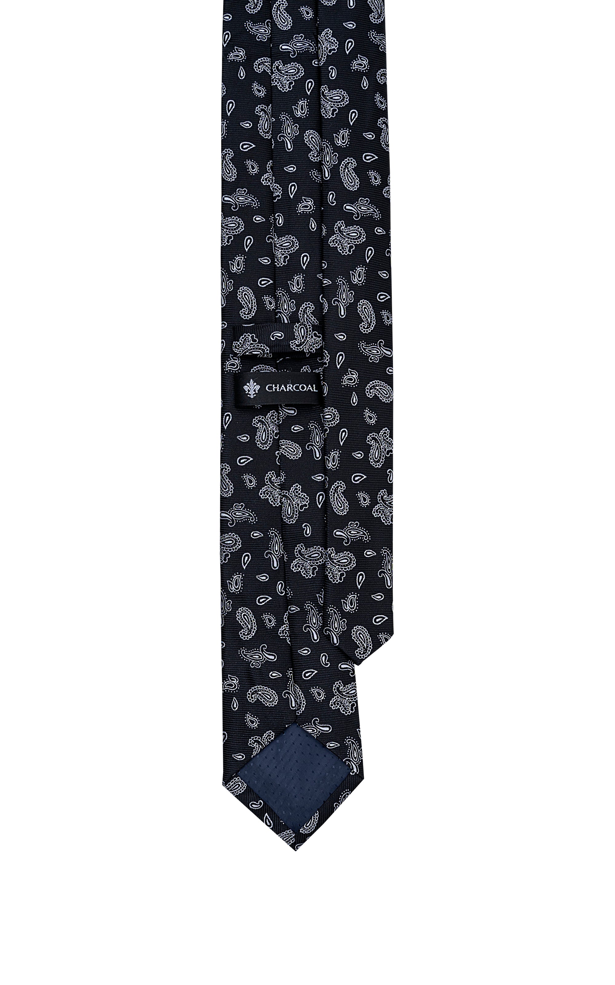 Dark poly silk tie with repeating paisley pattern, angled view of pointed tip