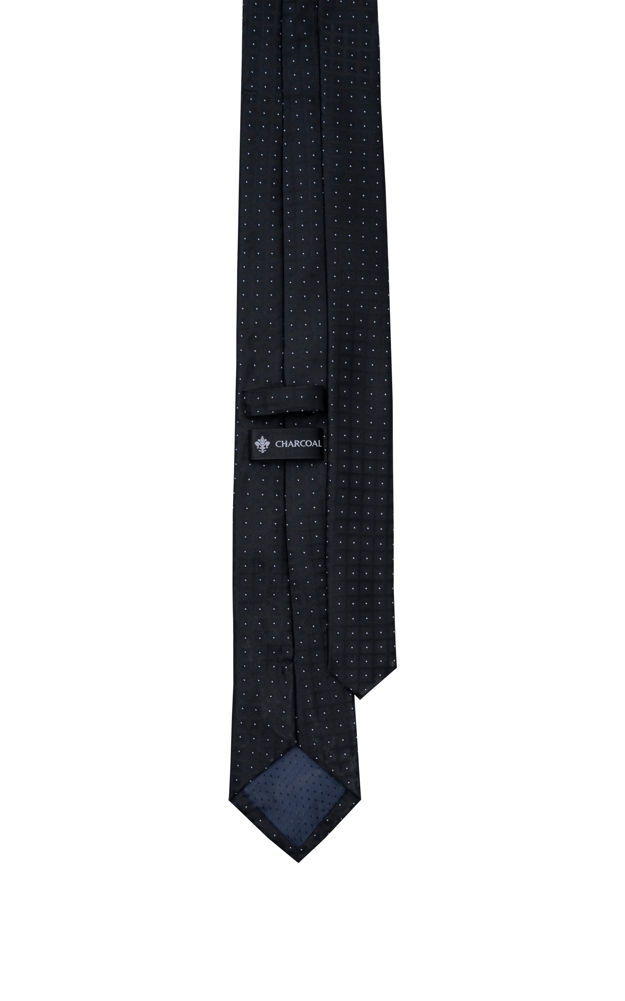 Dark navy dot-pattern tie with small logo near the keeper