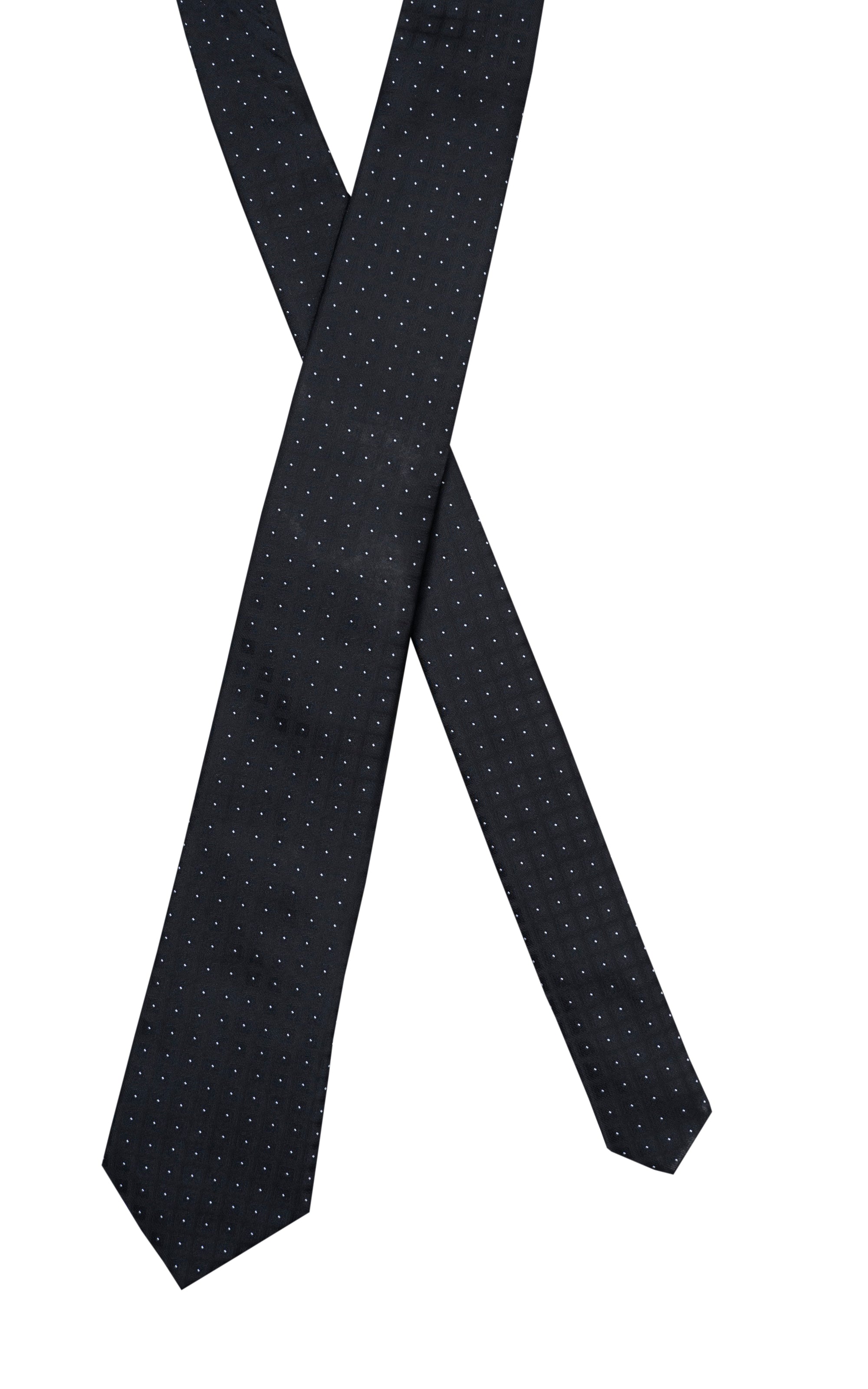 Dark navy dot-pattern tie draped in a crossed style