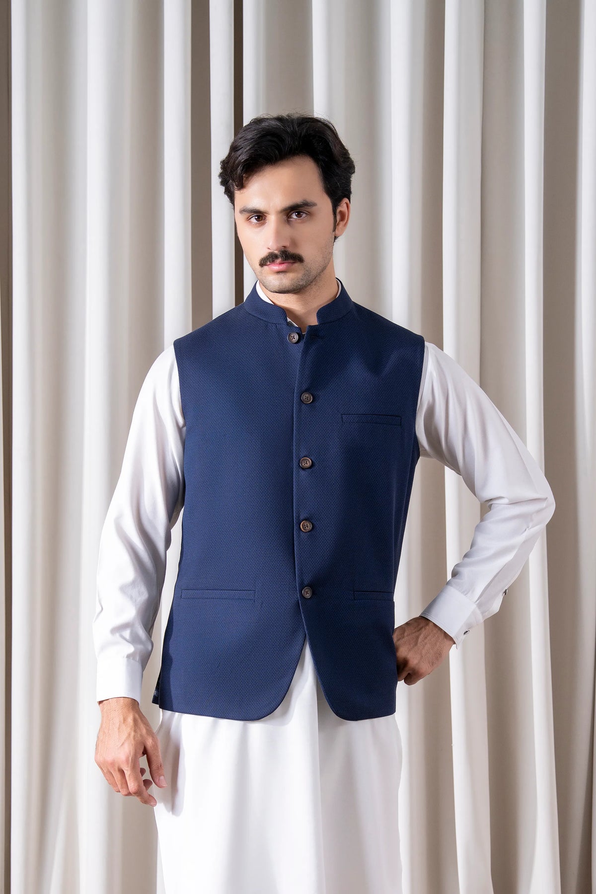 Navy cotton linen waistcoat with stand collar, four buttons, and front patch pockets