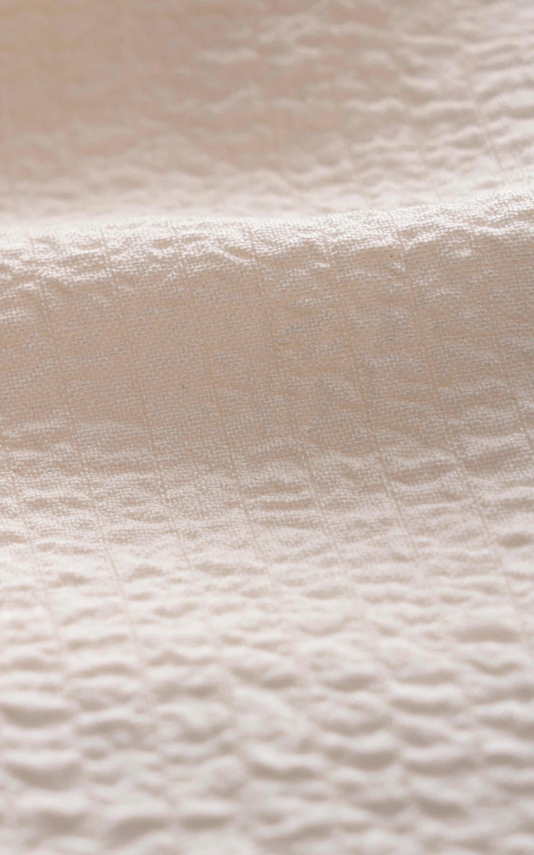 Off-white relaxed-fit shirt fabric texture close-up