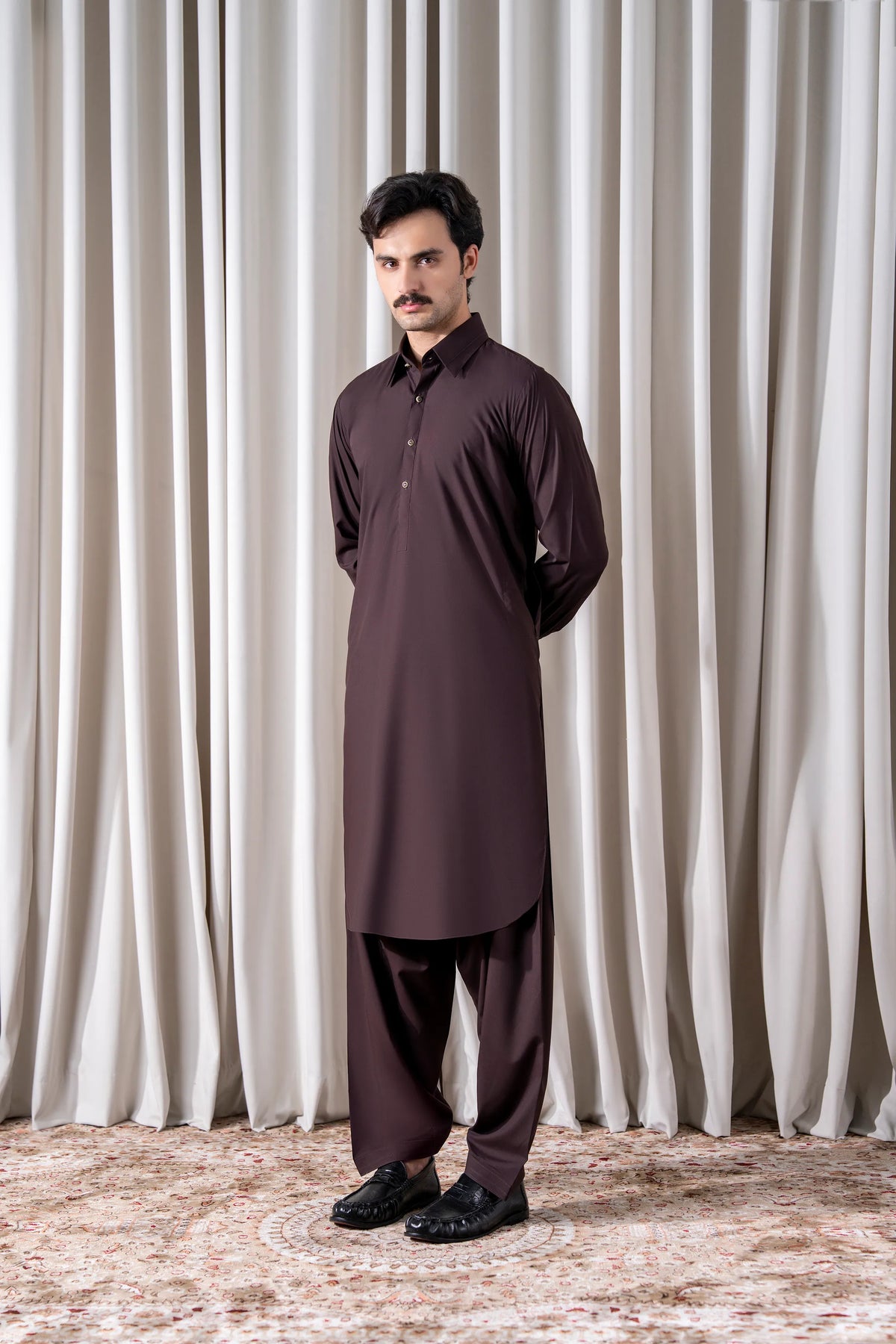 Men's maroon kameez shalwar set with high collar, long sleeves, and straight pants