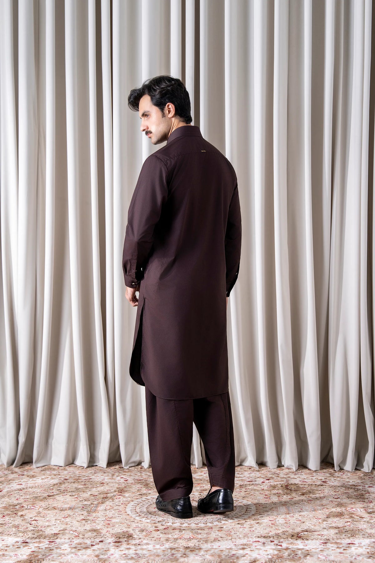 Men's maroon kameez shalwar set from back view, long shirt and matching trousers