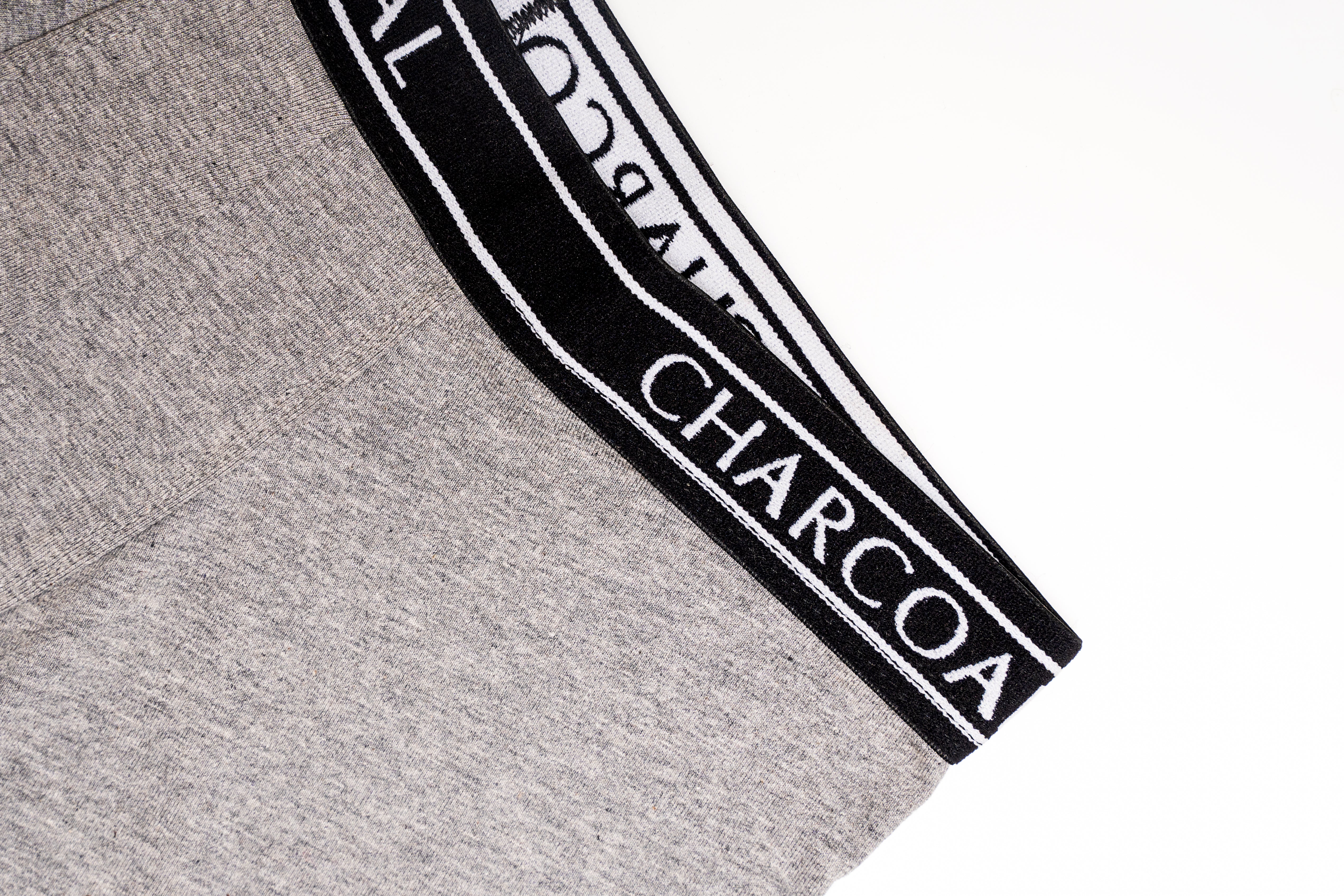 Heather grey boxer shorts corner with black waistband trim and “CHARCOAL” text