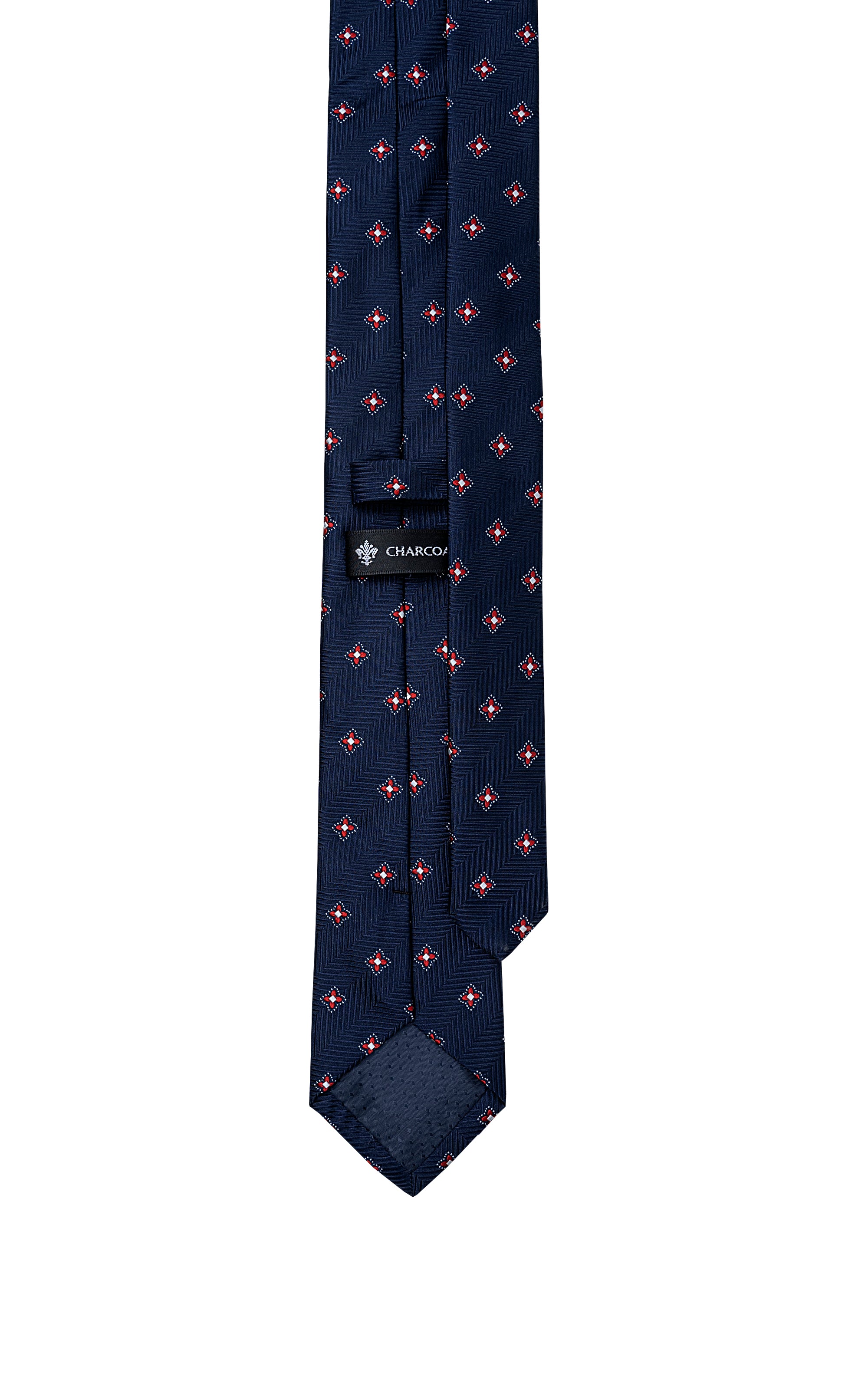 Navy poly-silk tie with red-and-white geometric repeat pattern and woven label