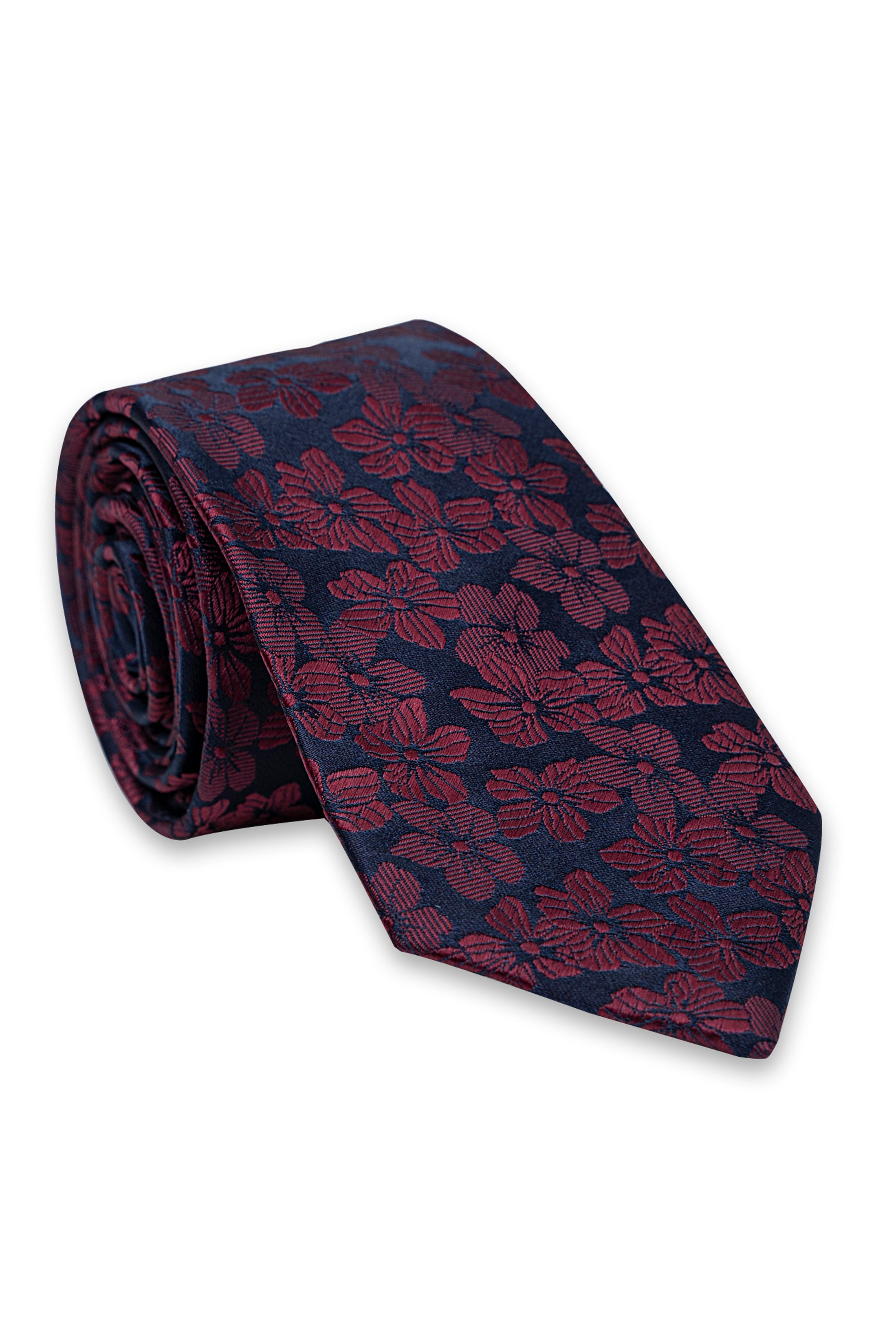 Poly-silk tie rolled up, navy base with burgundy floral pattern