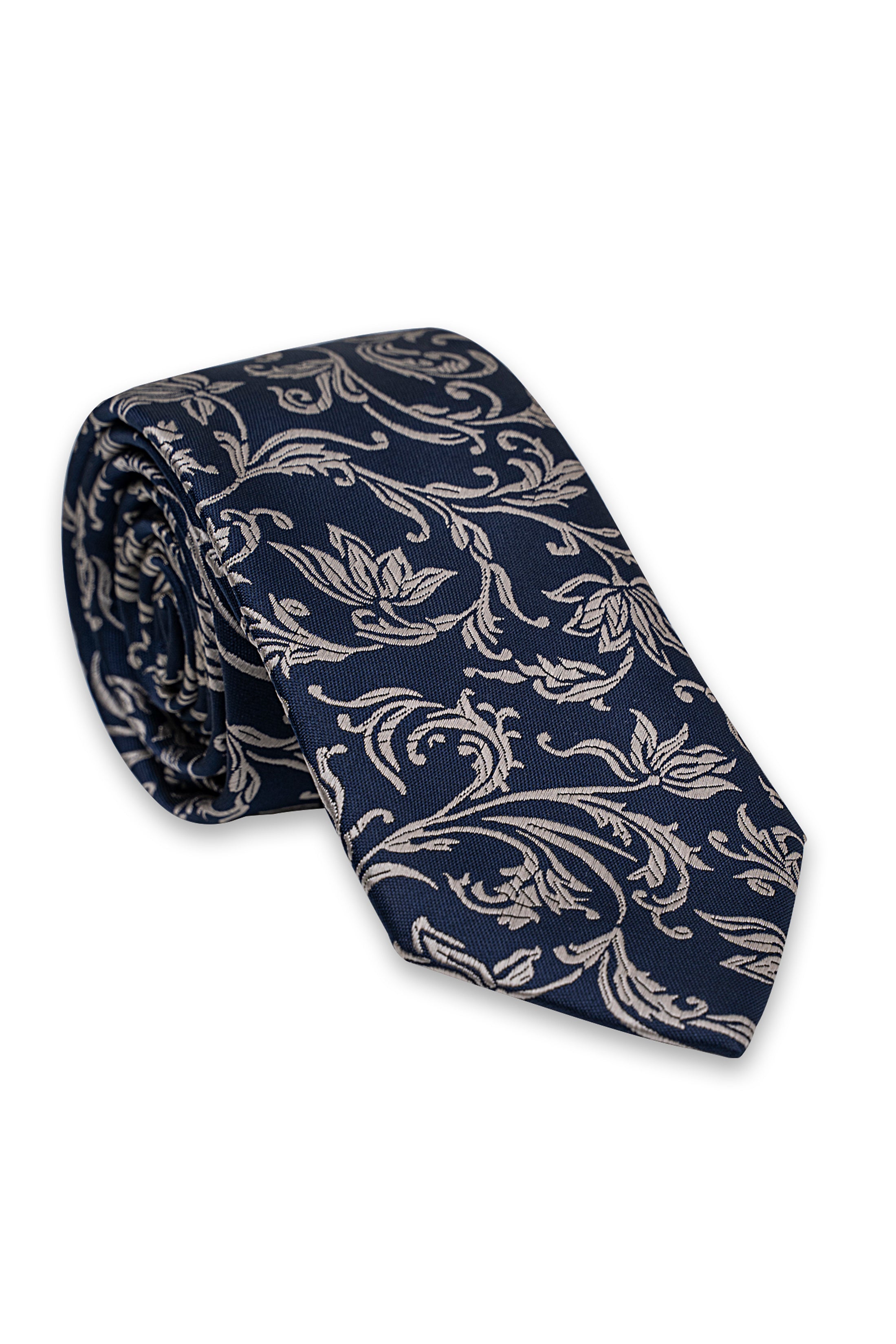 Poly silk tie rolled up, dark navy with light floral scroll print.