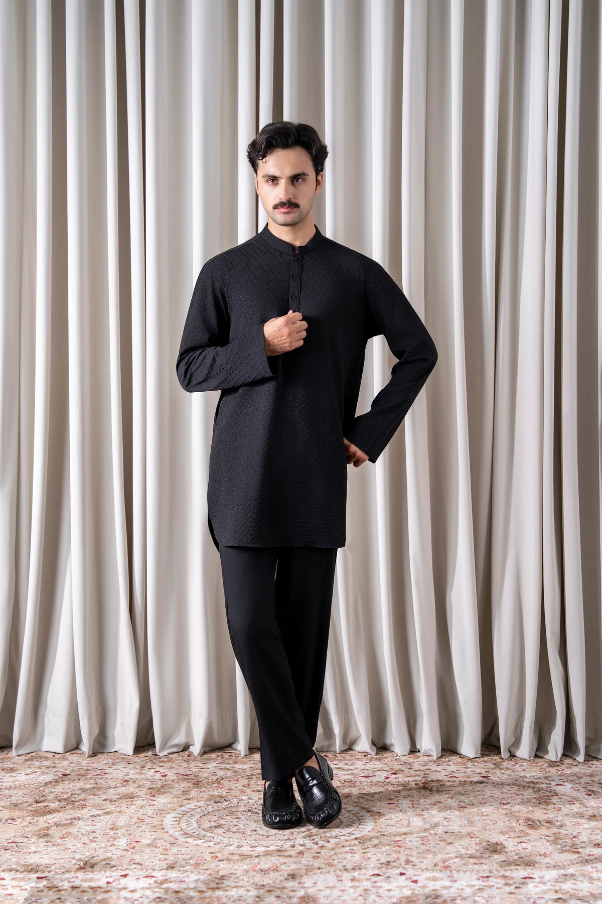 Men's black textured kurta pajama set, full front view with long sleeves