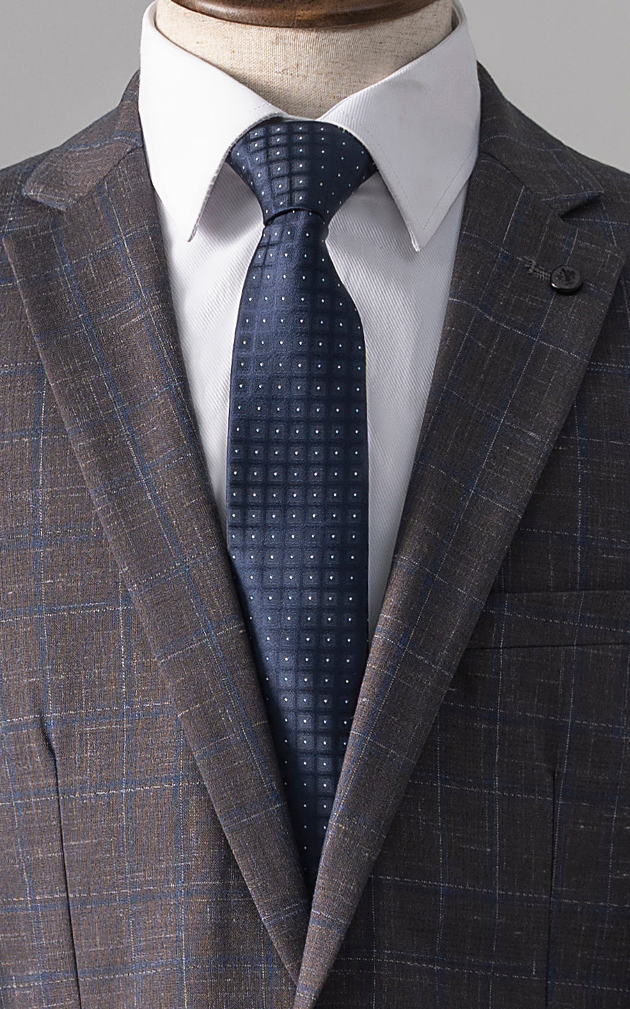 Slim-fit check suit jacket with white shirt and navy patterned tie