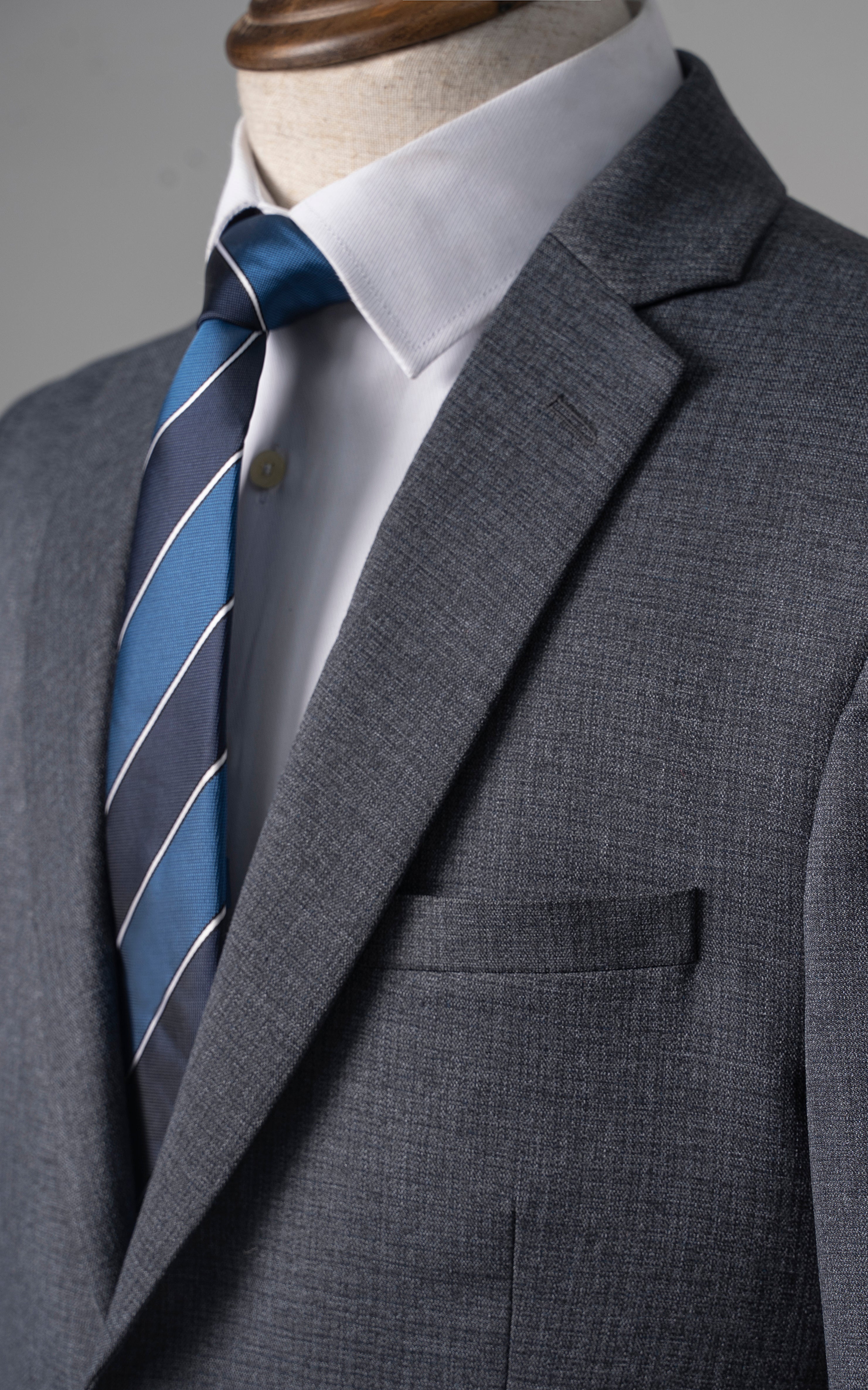 Bluish grey suit jacket with notch lapel and chest pocket