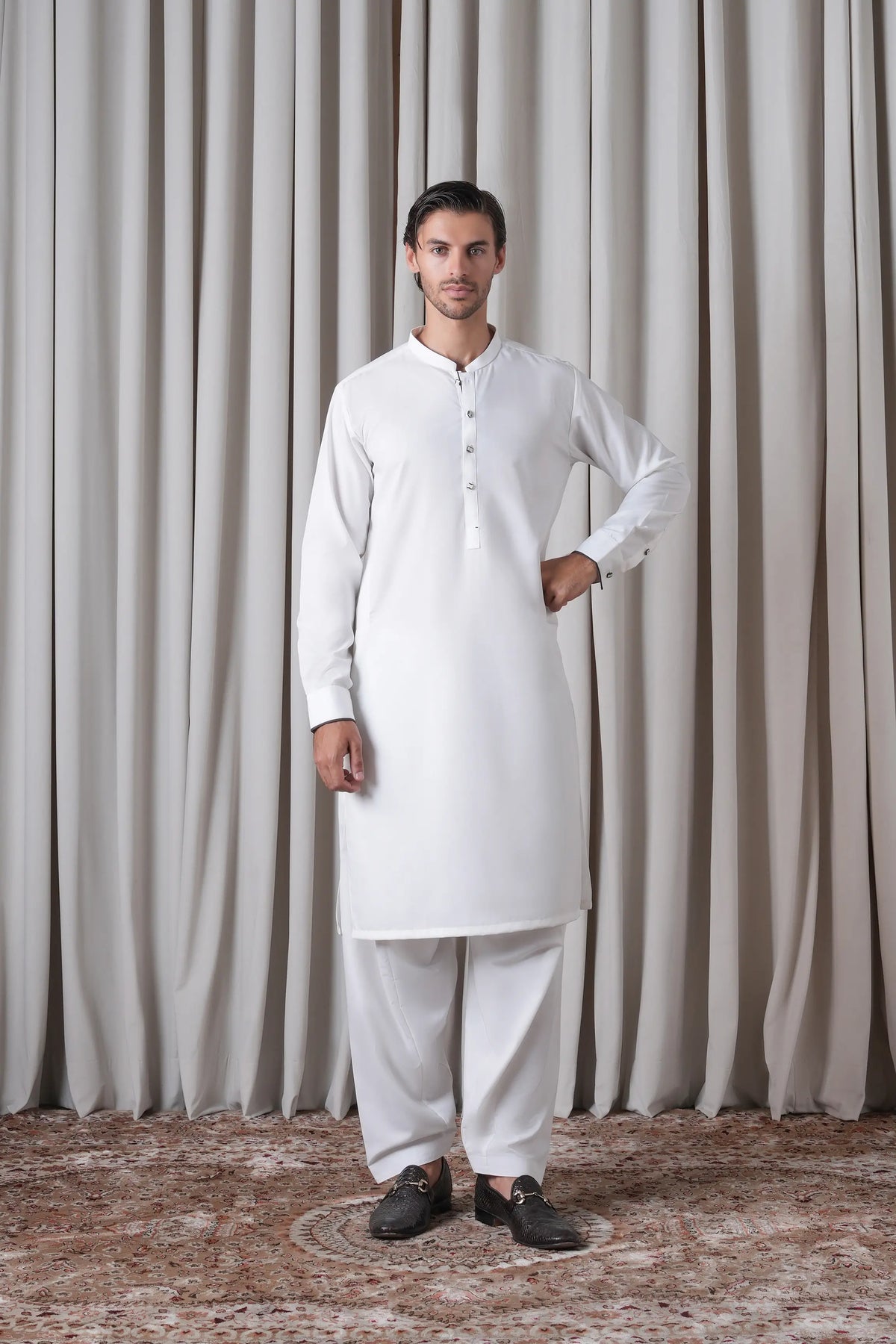 White kameez shalwar set with buttoned stand collar and matching straight trousers